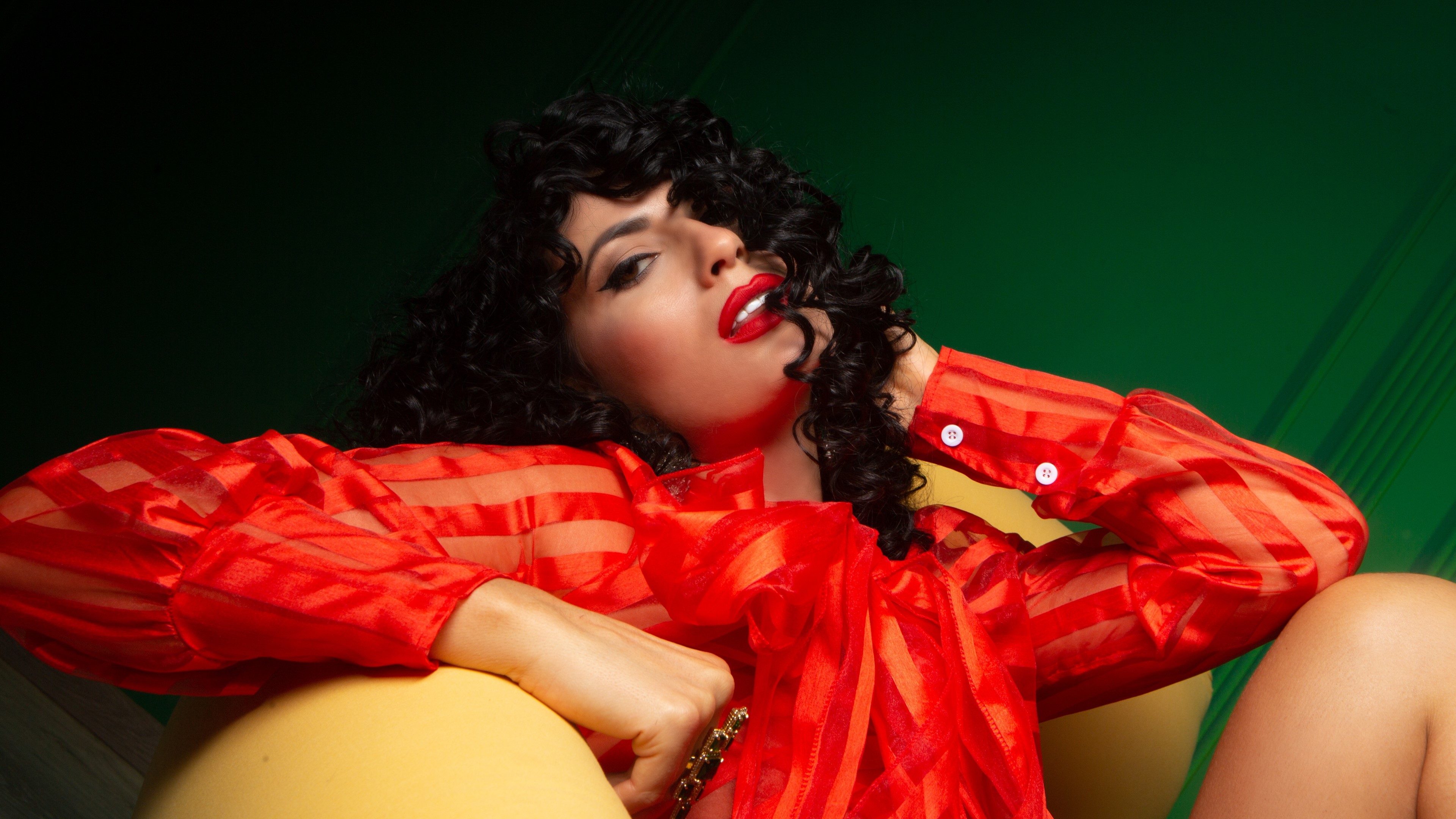 Woman in red shirt with curly hair HD Wallpaper