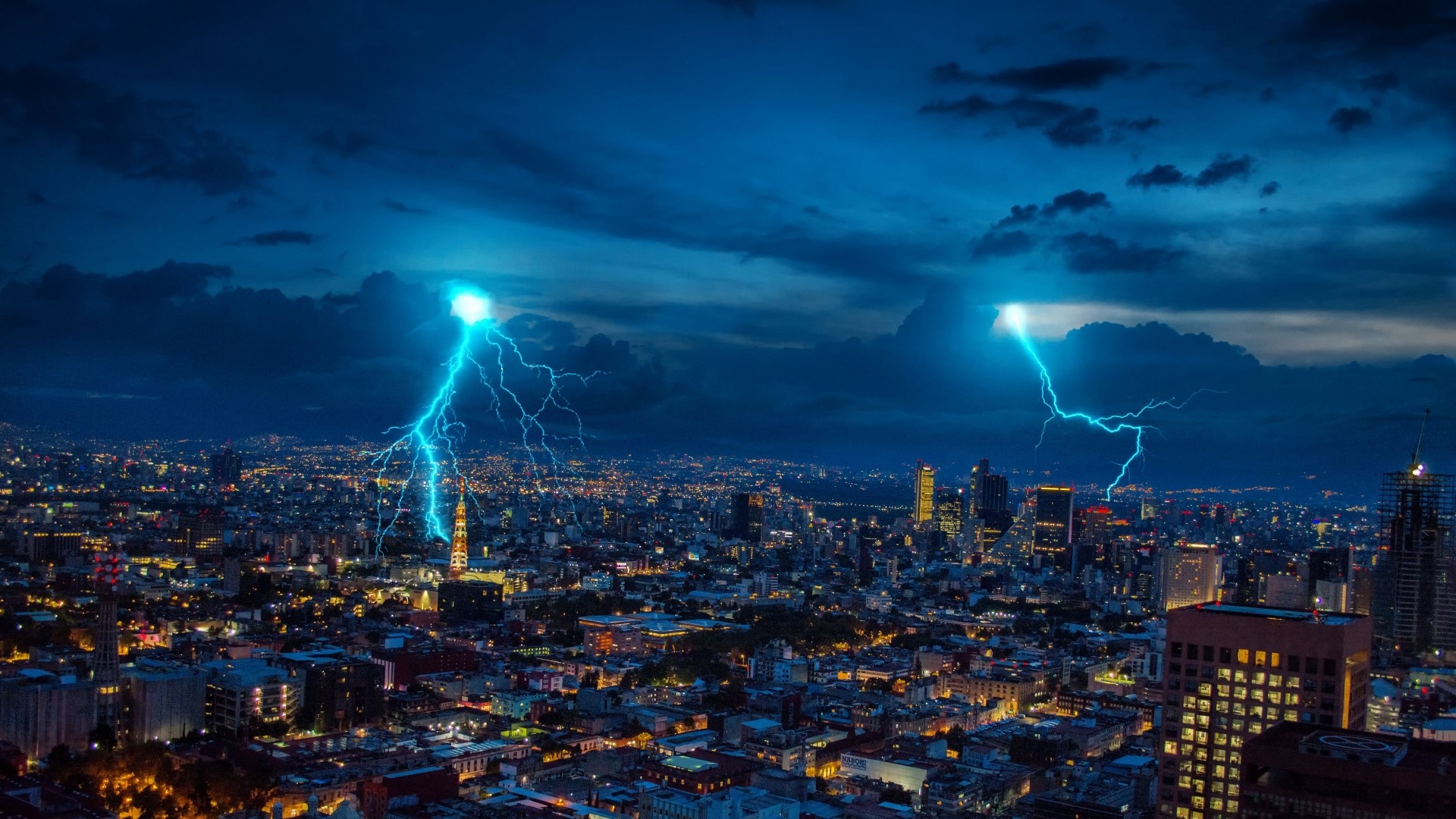 Cityscape at Night with Lightning Strikes HD Wallpaper