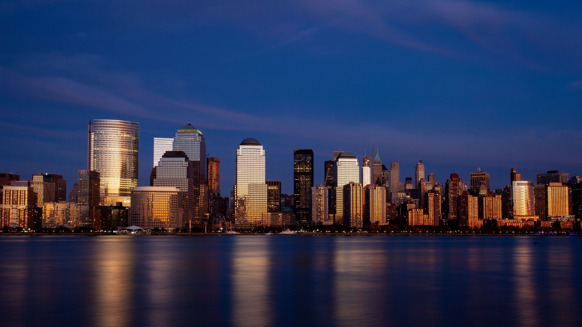 New York City skyline at dusk over water HD Wallpaper