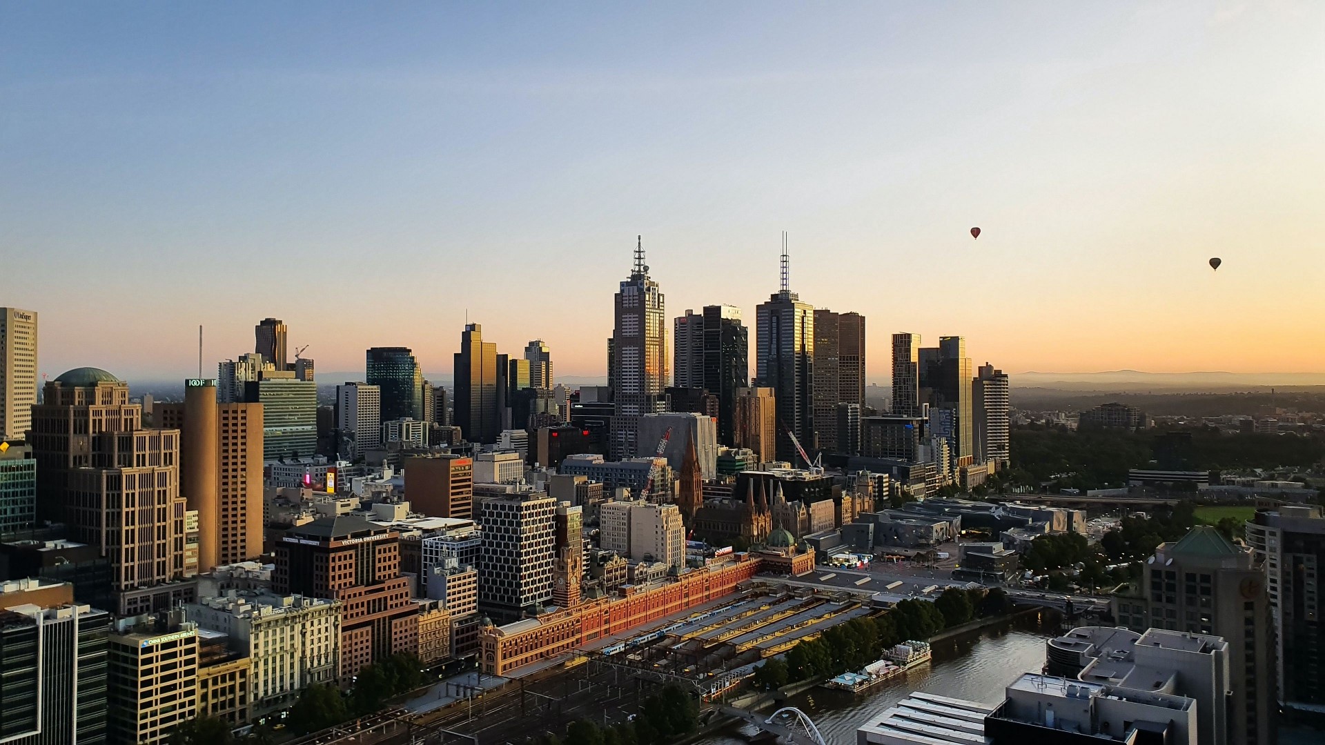 Melbourne Skyline at Sunrise with Hot Air Balloons HD Wallpaper