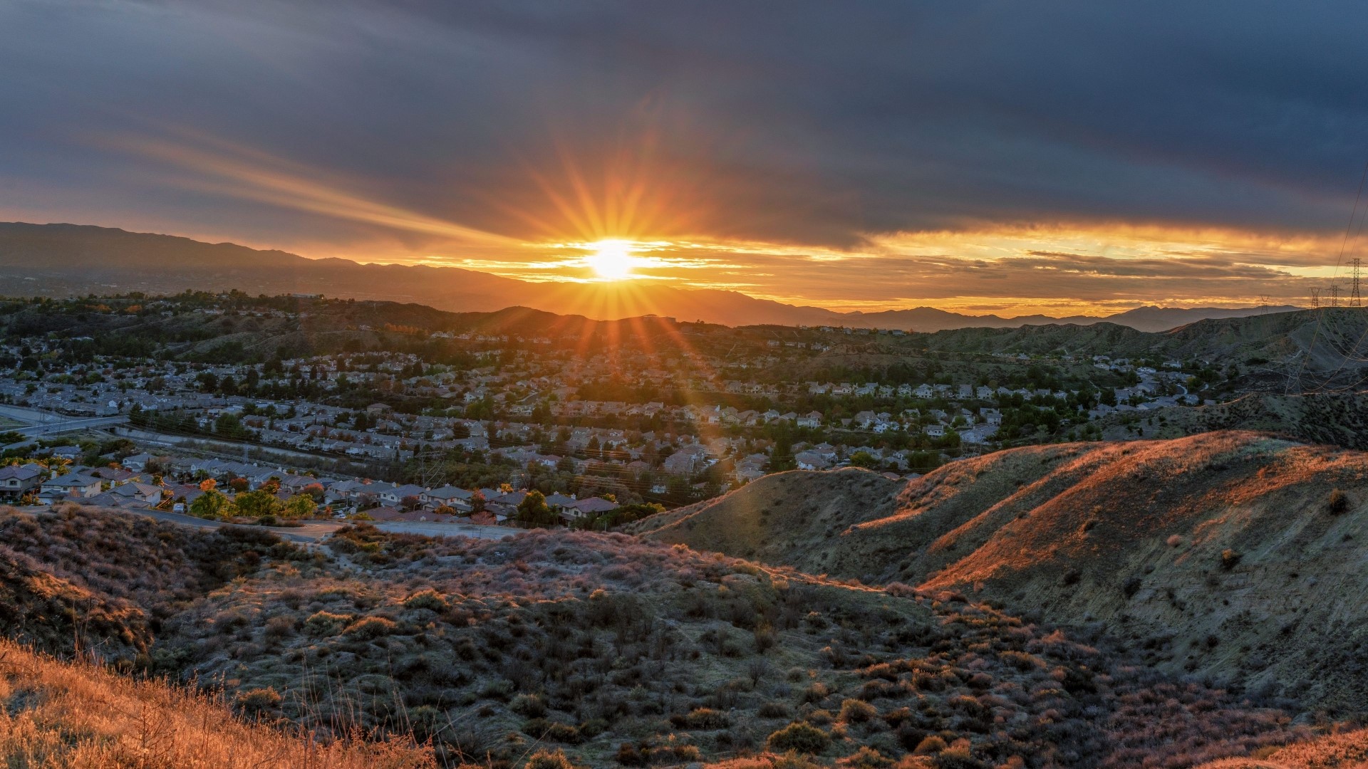 Sunset over a suburban valley with mountains HD Wallpaper