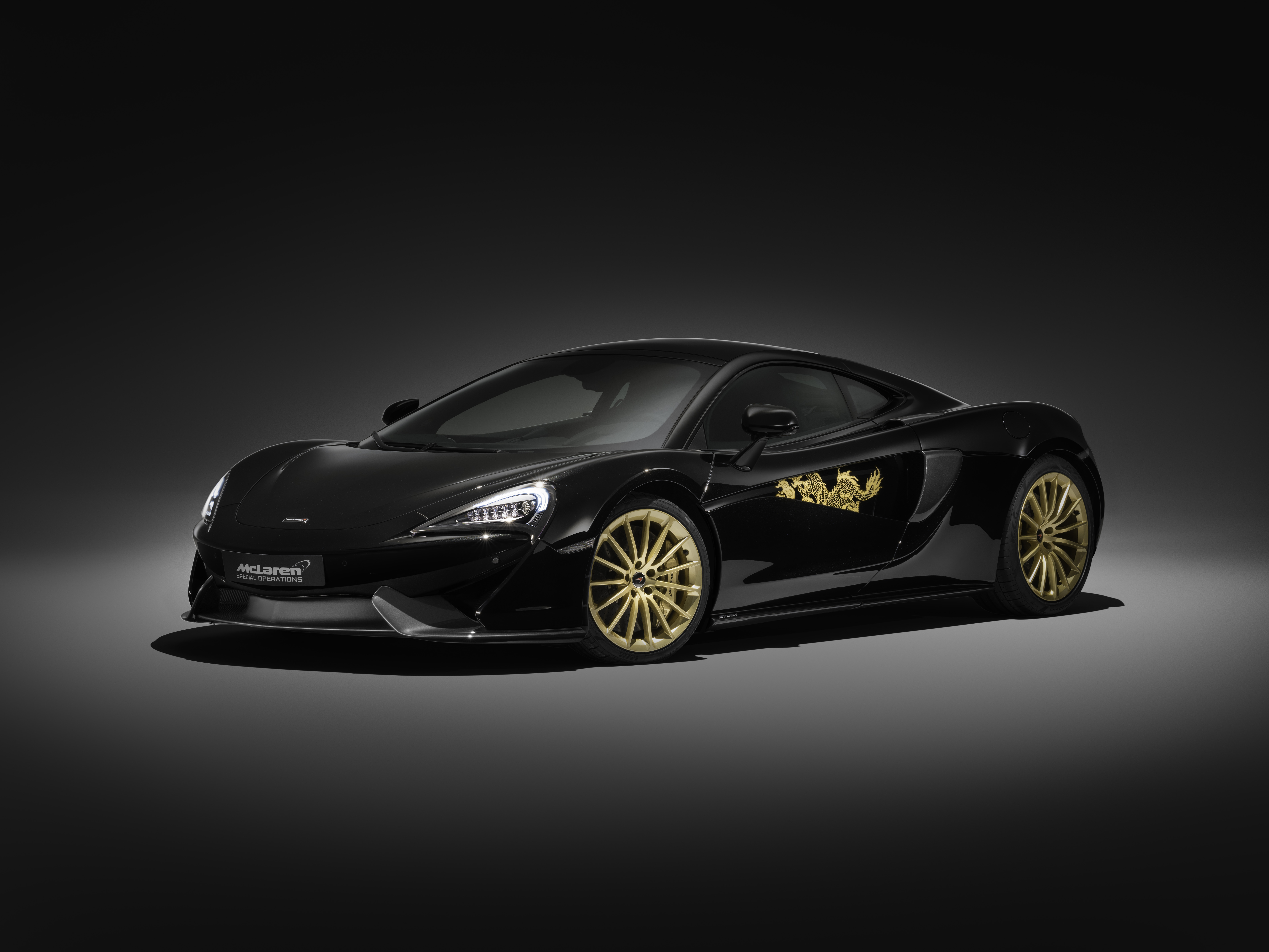 Black McLaren MSO 570GT with gold dragon decal HD Wallpaper