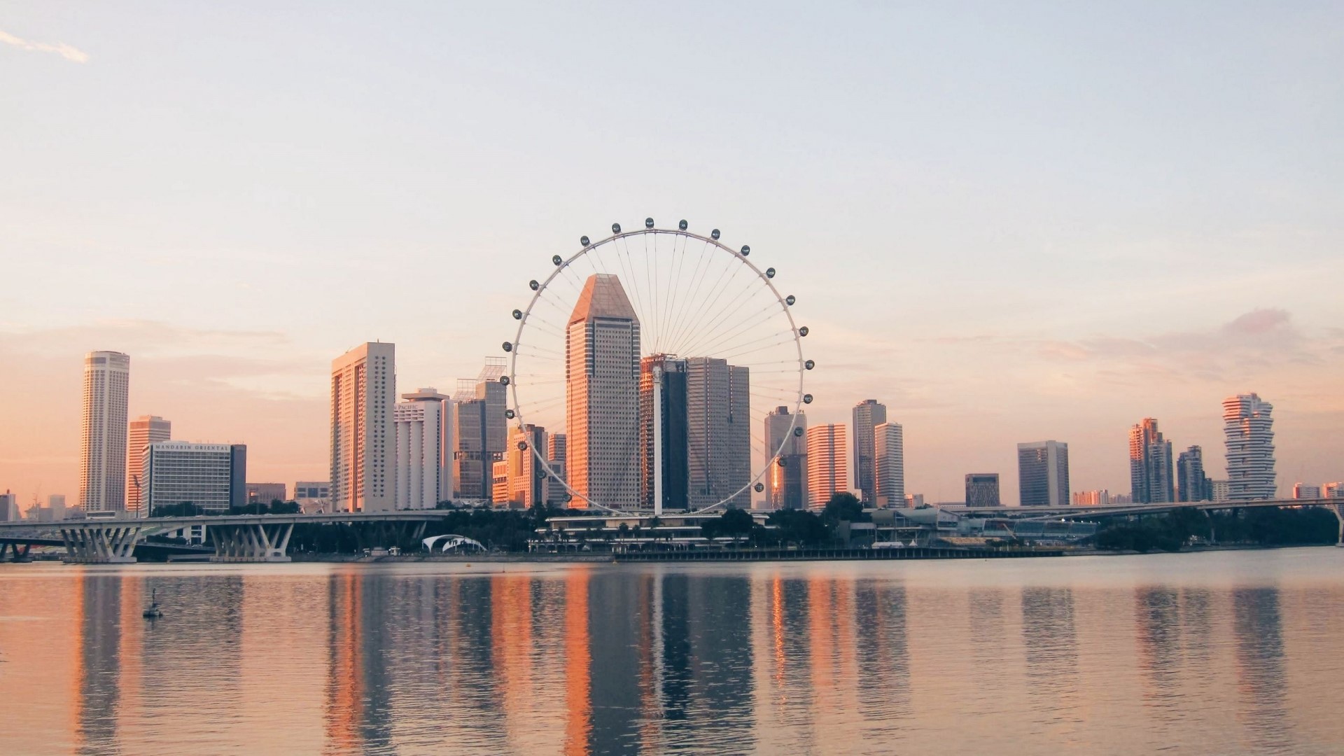 Singapore Flyer Ferris wheel and skyline at sunset HD Wallpaper