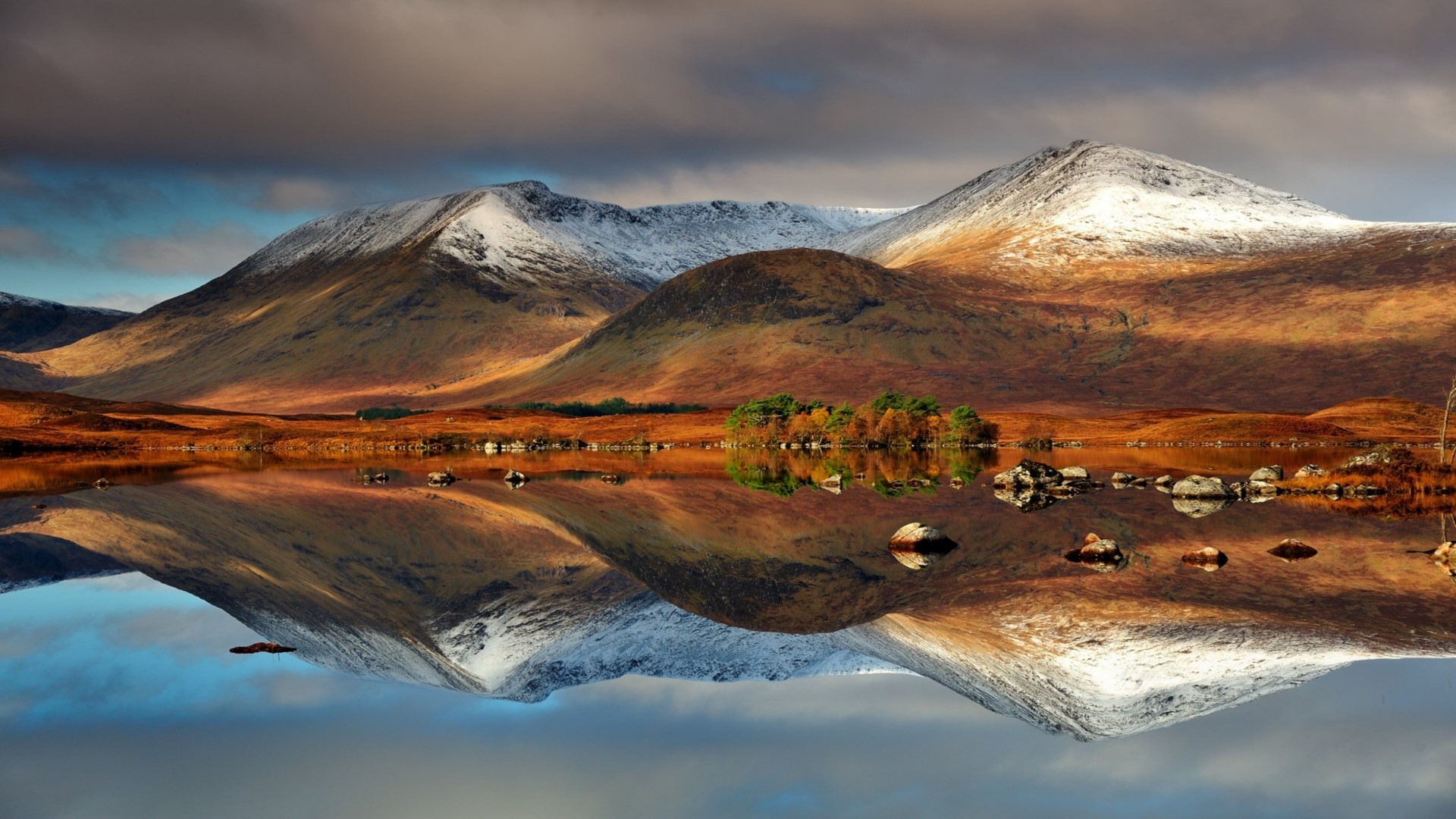 Snow-capped mountains reflected in a lake HD Wallpaper