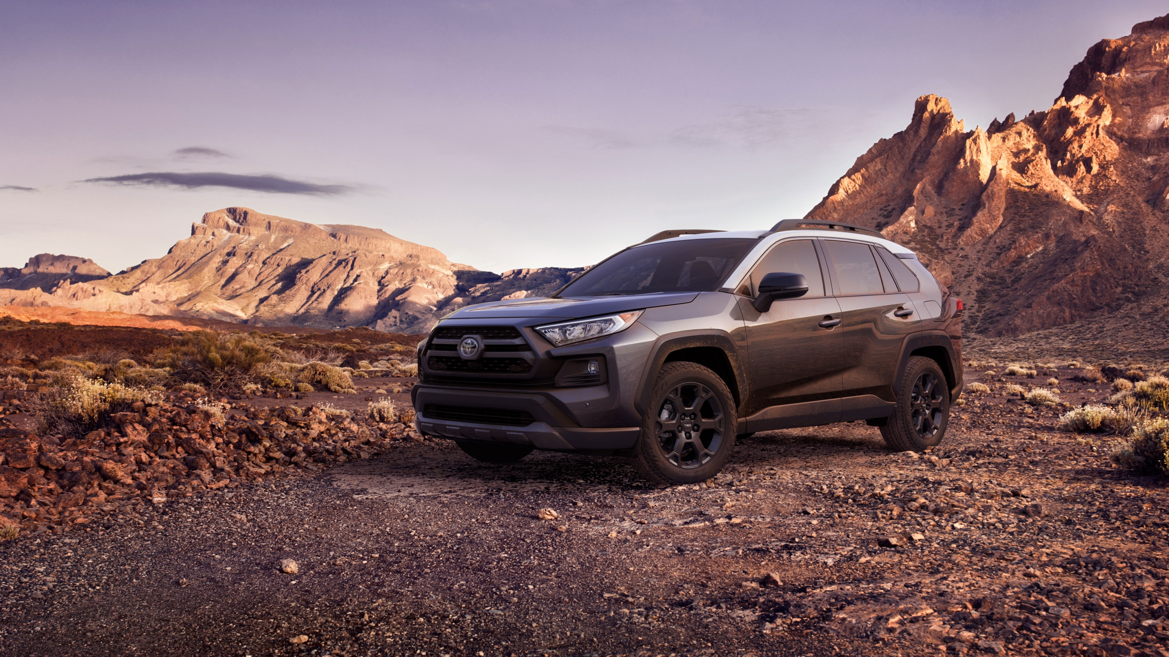 Toyota RAV4 in a rocky mountain landscape HD Wallpaper