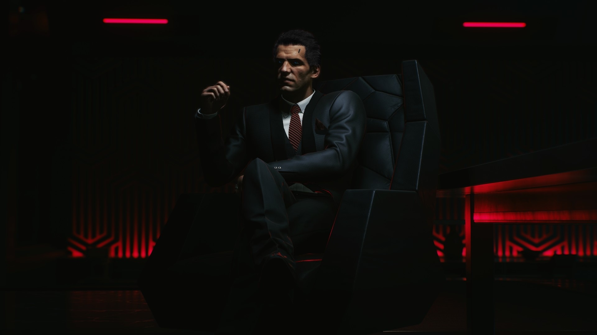 Man in suit sitting in chair in Cyberpunk 2077 HD Wallpaper