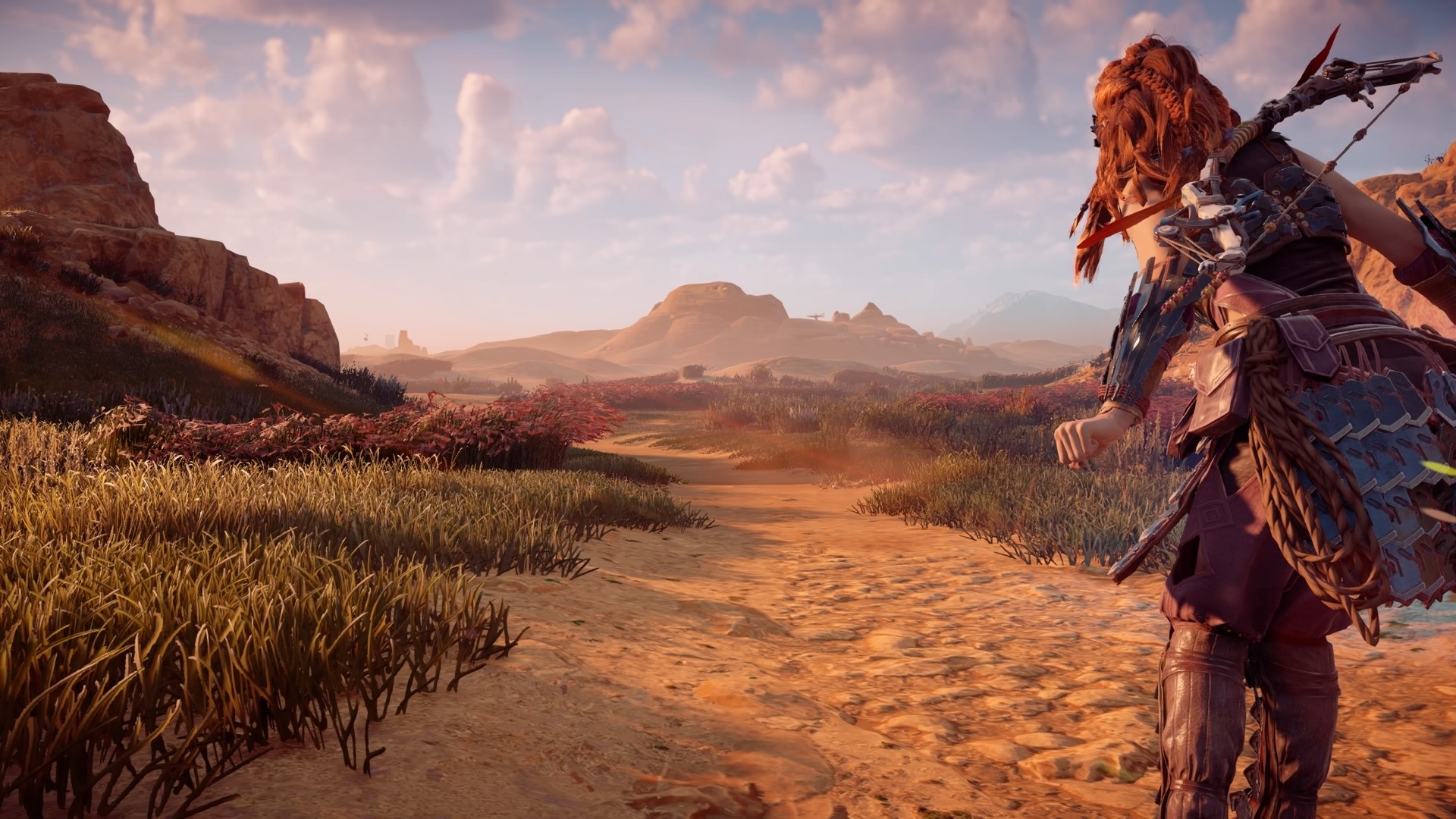 Aloy from Horizon Zero Dawn in a desert landscape HD Wallpaper