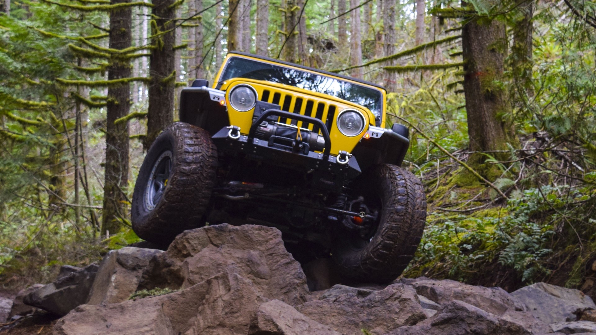 Yellow Jeep Wrangler off-roading on rocks HD Wallpaper