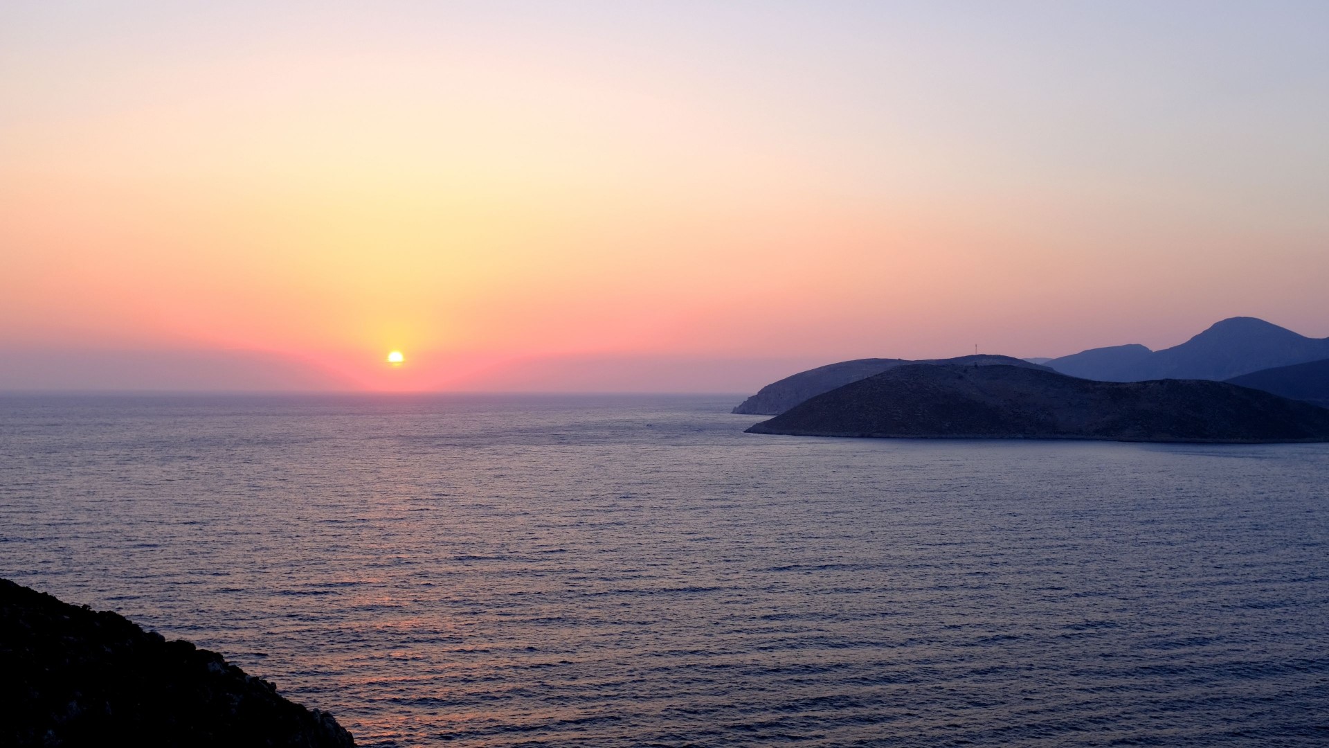 Sunset over the sea with islands HD Wallpaper