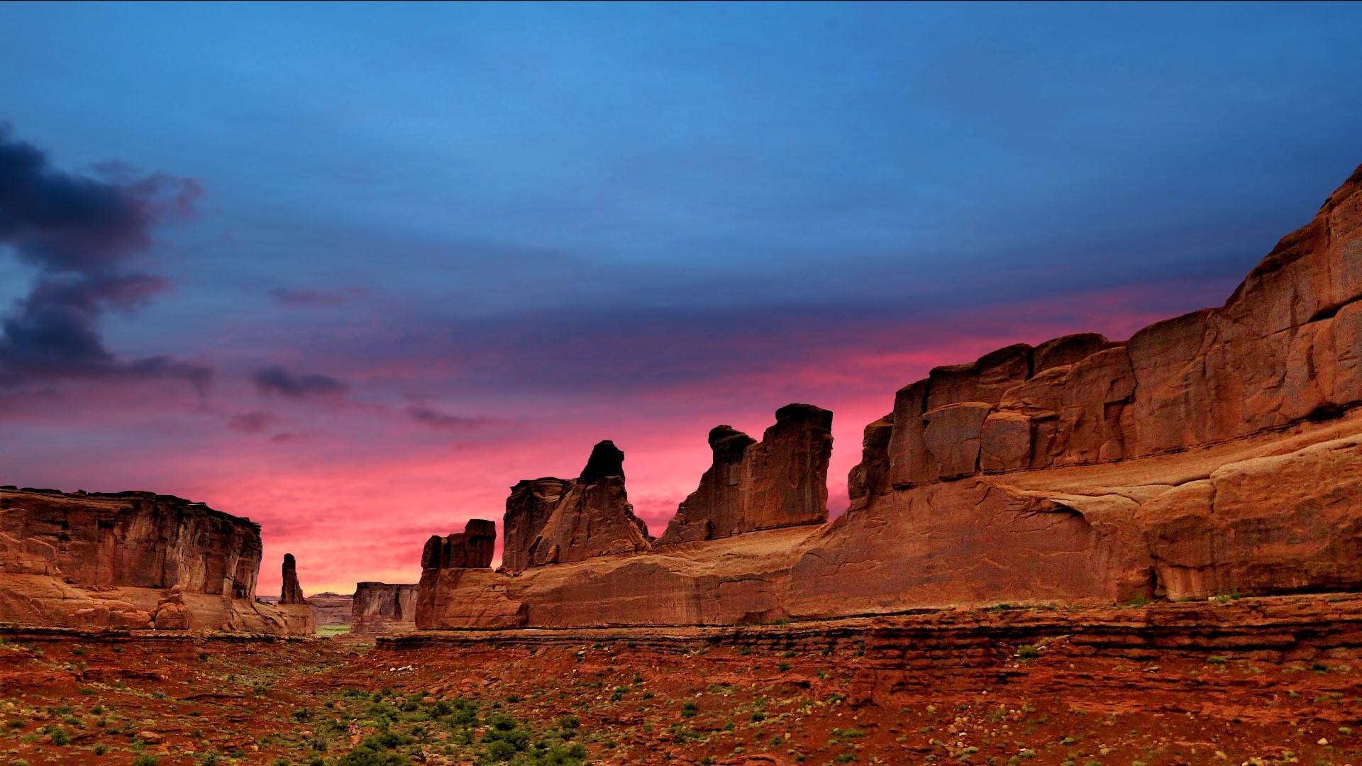 Desert rock formations at sunset HD Wallpaper