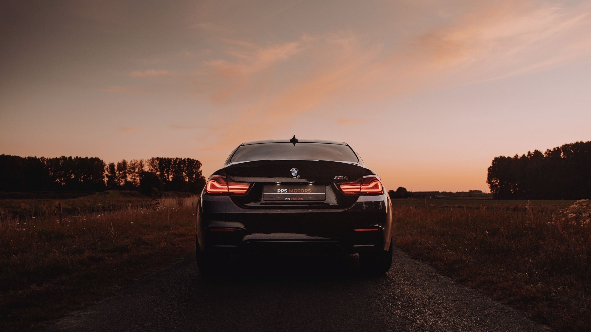 Black BMW M4 at sunset HD Wallpaper