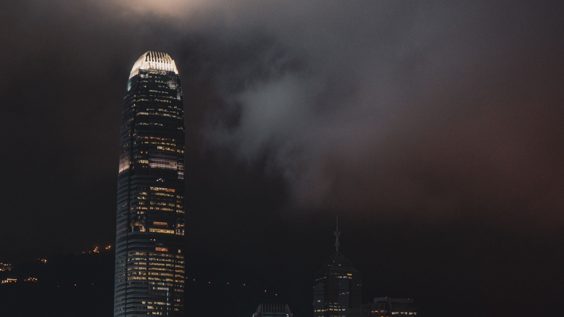 Hong Kong skyscrapers at night with clouds HD Wallpaper