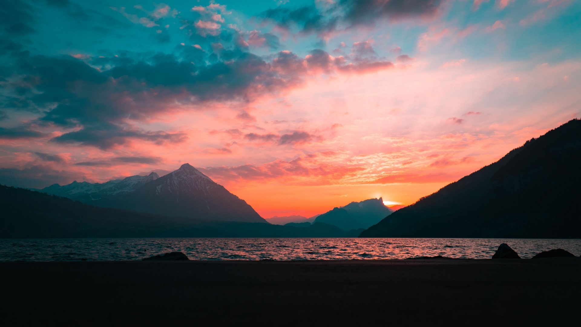 Sunset over a lake with mountains HD Wallpaper