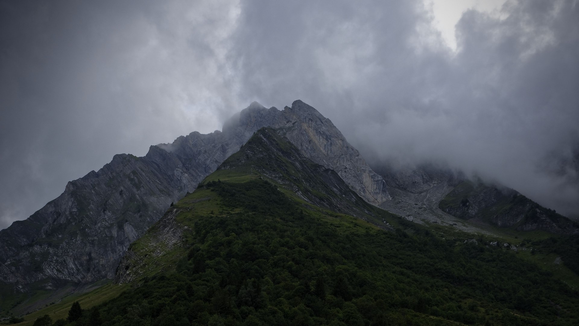 Misty Mountain Peaks with Green Slopes HD Wallpaper