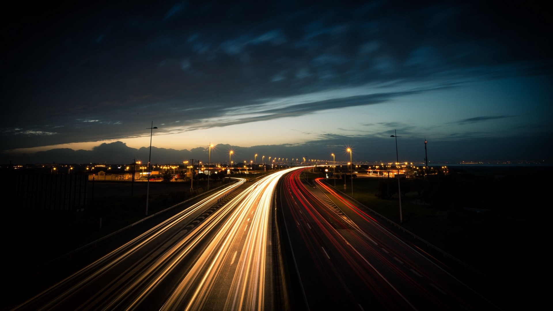 Highway light trails at dusk HD Wallpaper