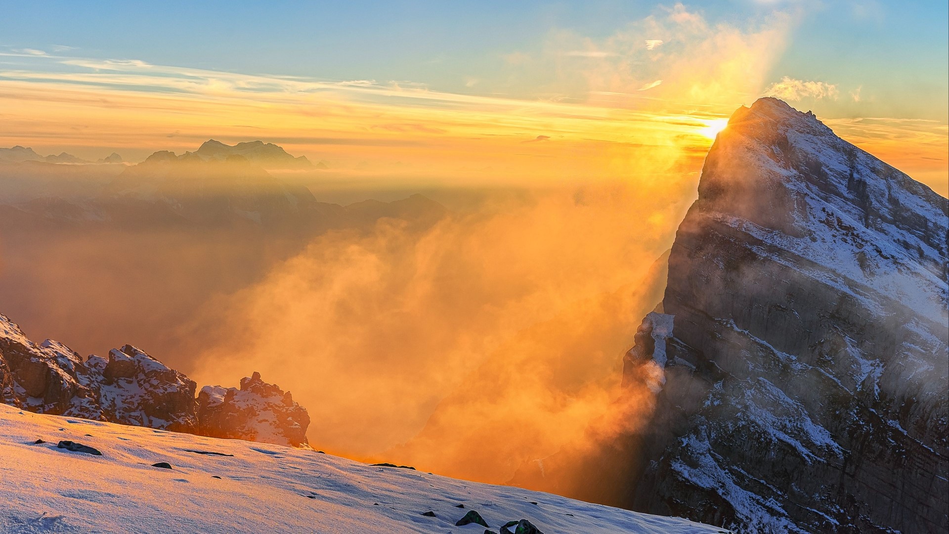 Sunrise over snowy mountains with clouds HD Wallpaper