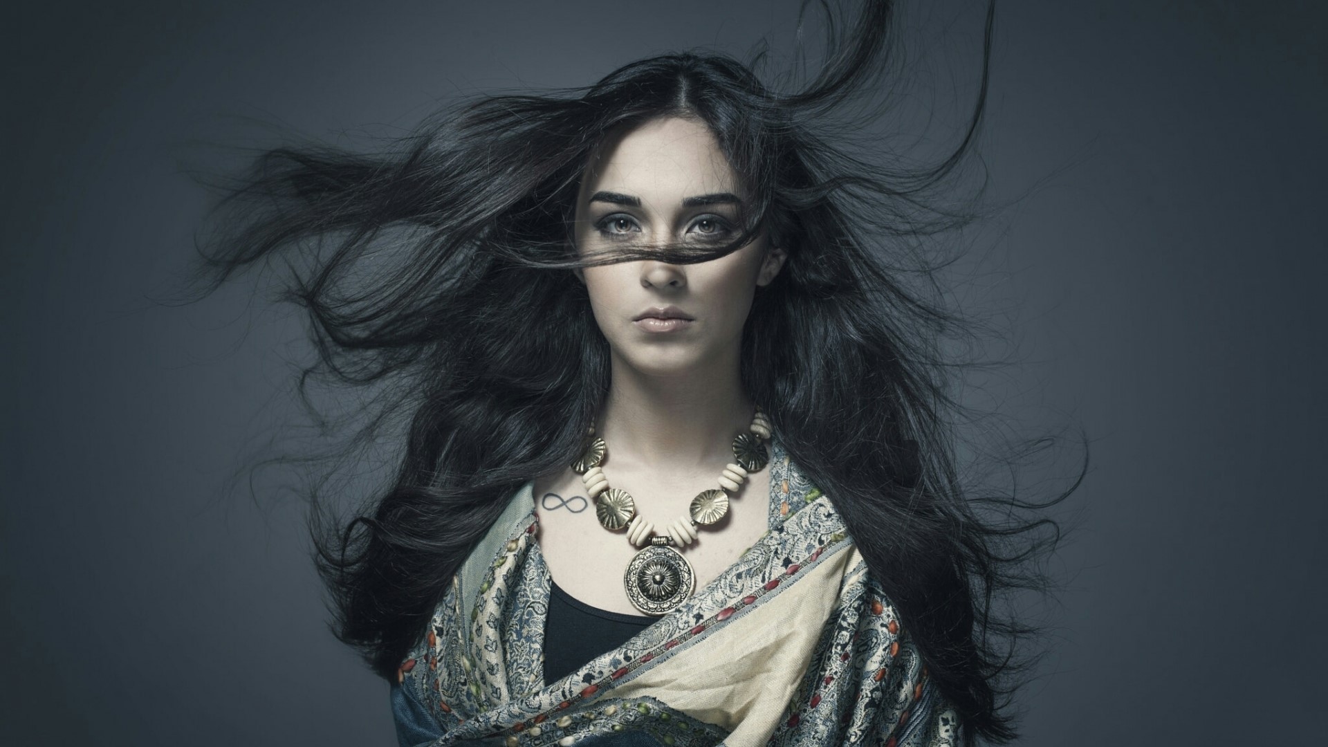 Woman with long dark hair and a necklace HD Wallpaper