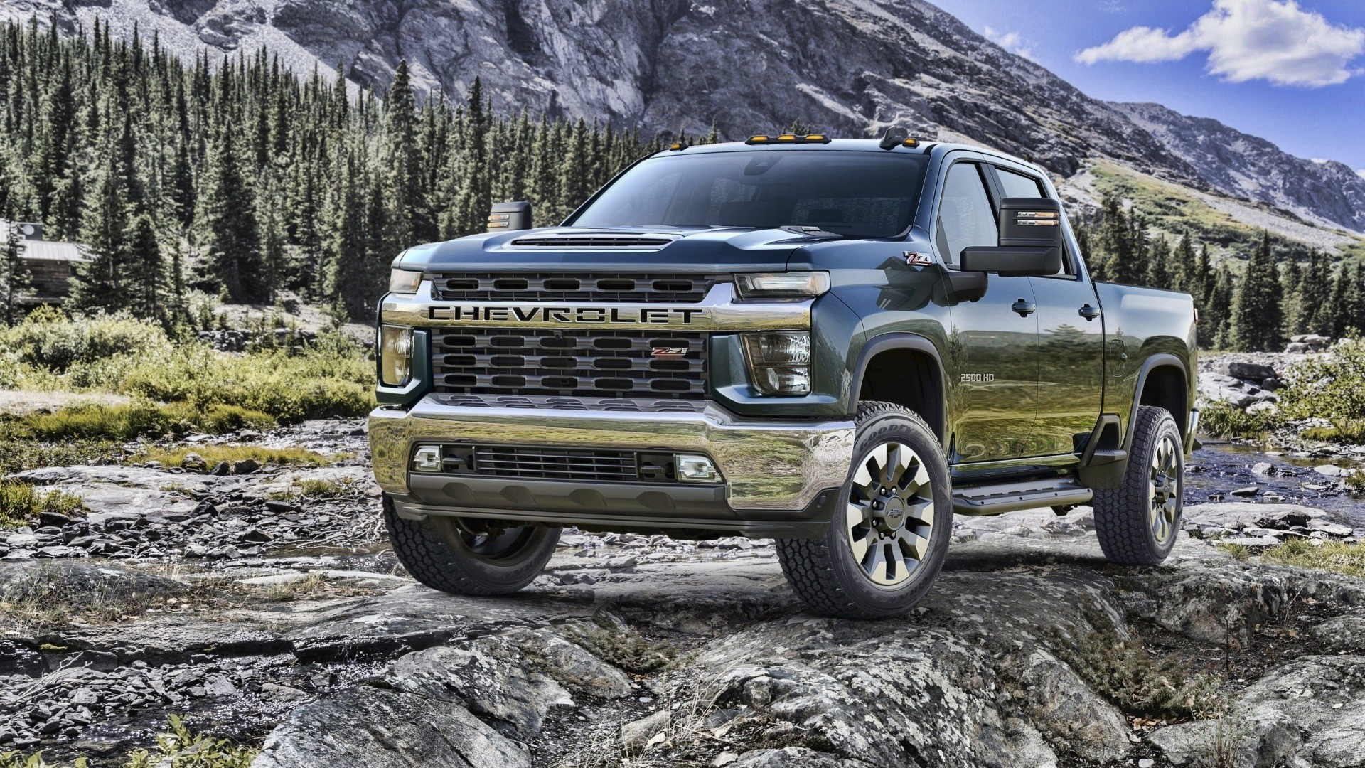 Chevrolet 2500 HD truck in a mountain landscape HD Wallpaper