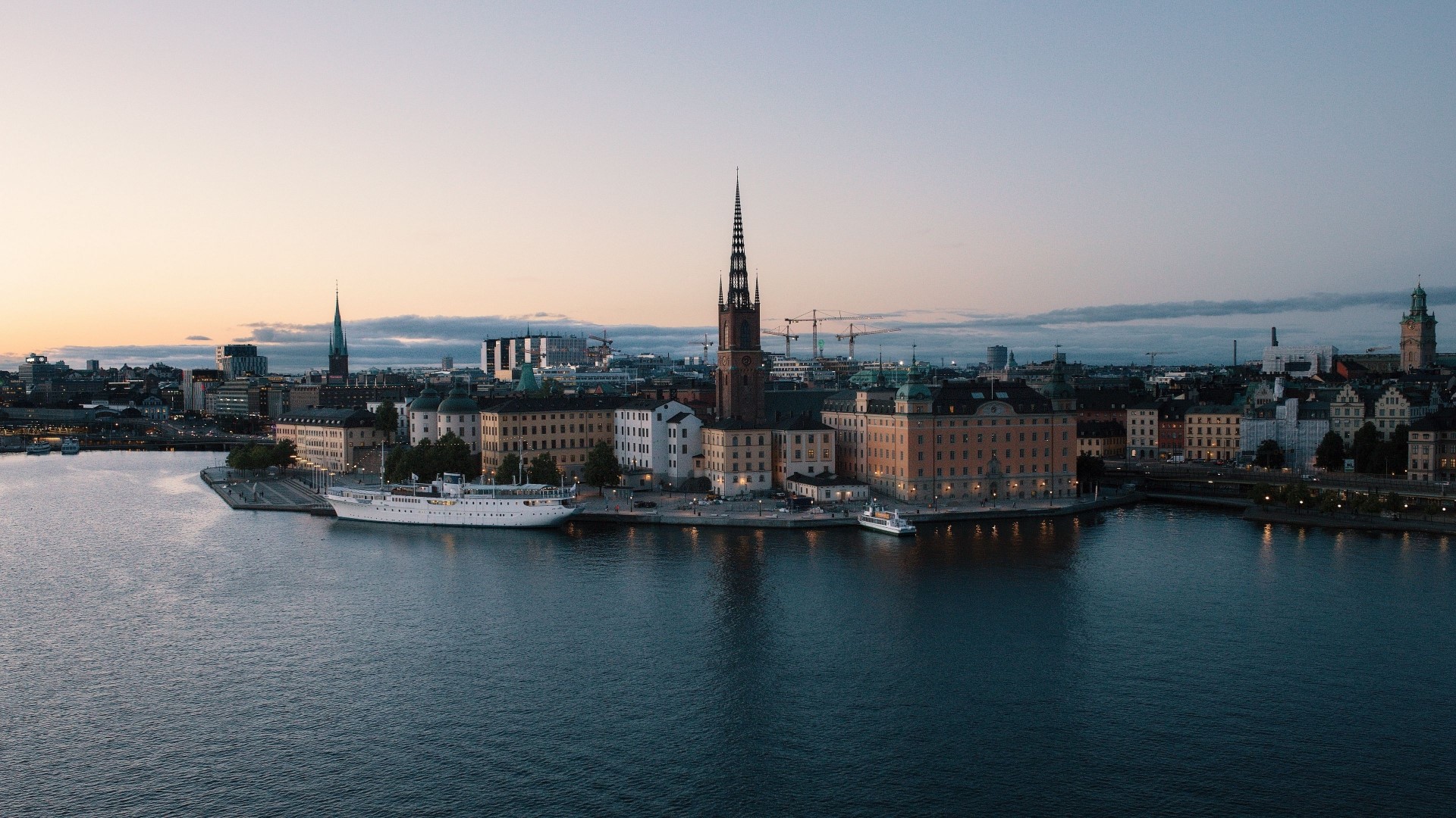 Stockholm cityscape with water and buildings HD Wallpaper