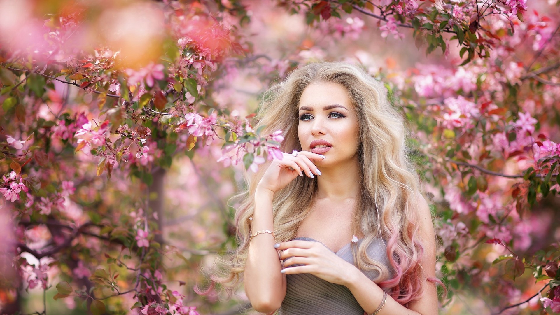 Woman with blonde hair among pink flowers HD Wallpaper