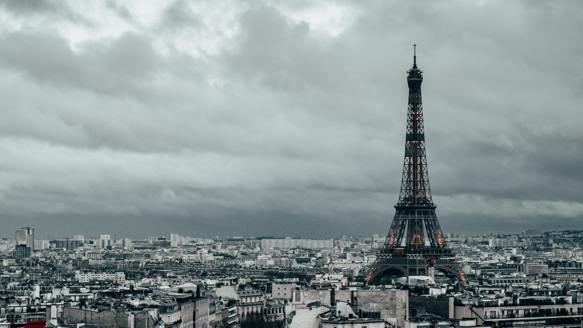 Eiffel Tower and Paris cityscape under cloudy sky HD Wallpaper