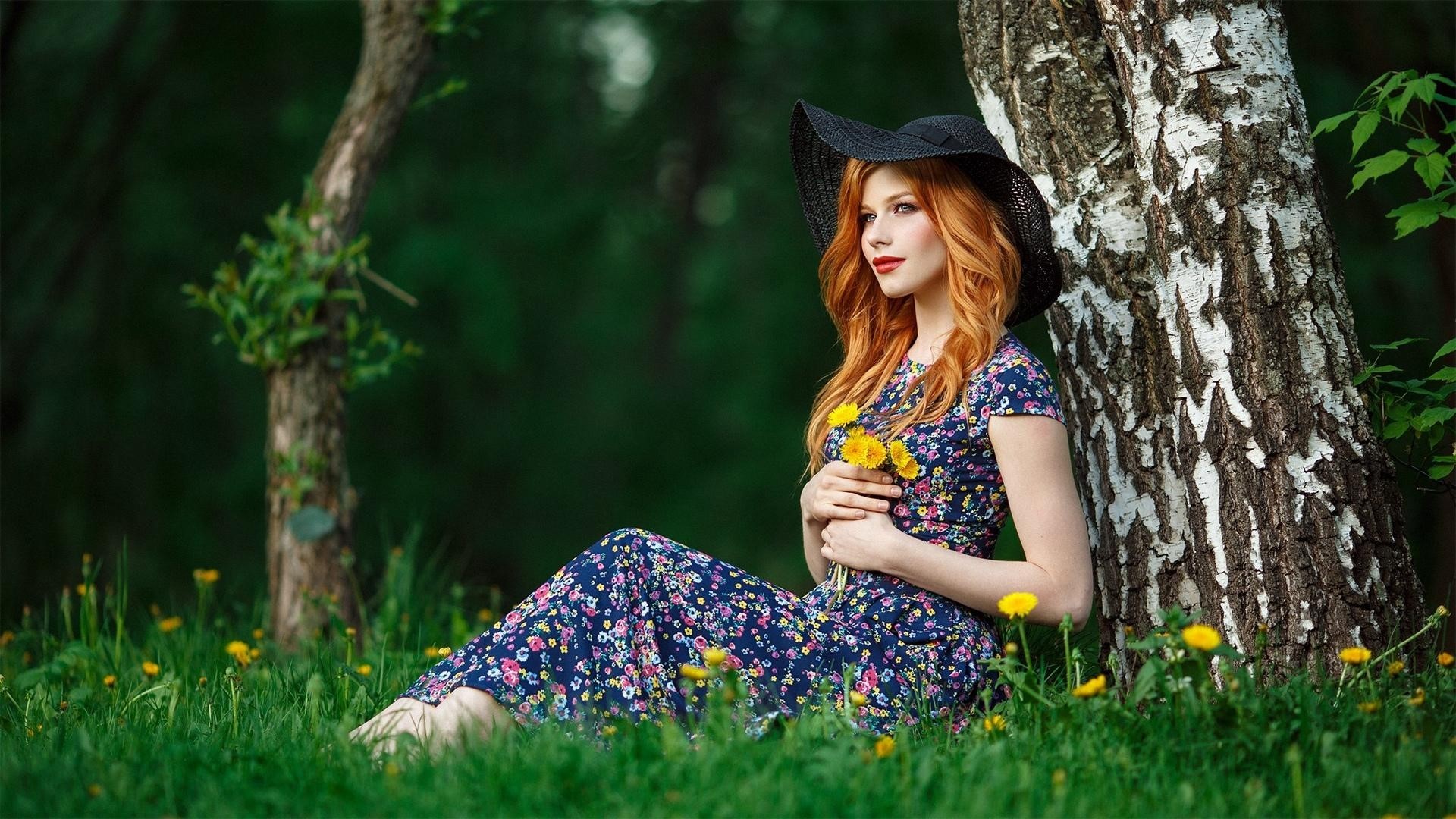 Red-haired woman in a hat and dress holding flowers HD Wallpaper