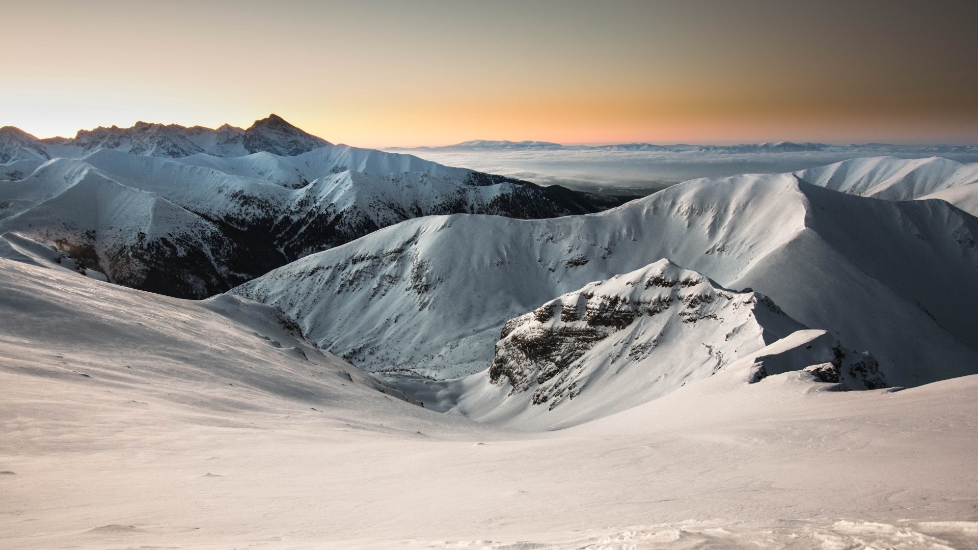 Snowy mountains at sunset HD Wallpaper