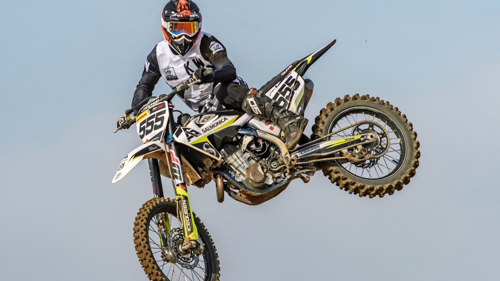 Motocross rider with number 555 in the air HD Wallpaper