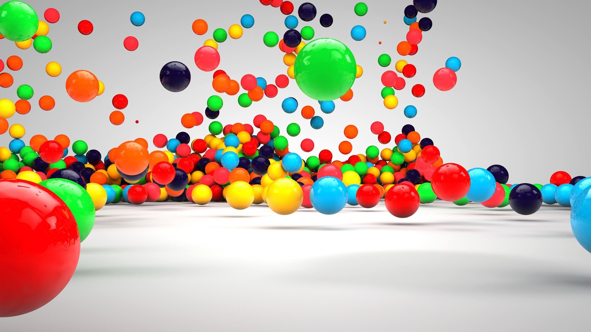 Colorful 3D spheres falling and bouncing HD Wallpaper