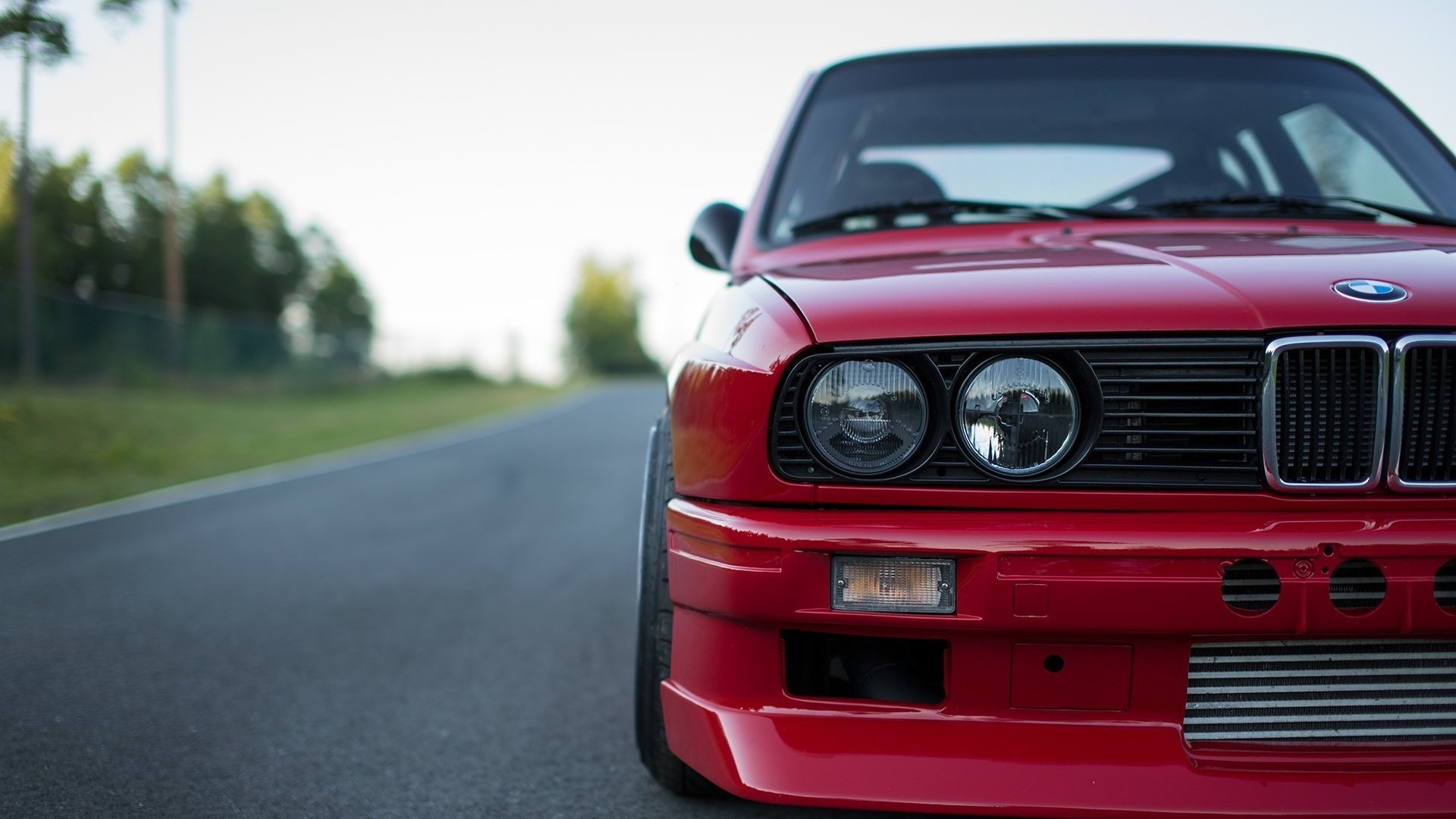 Red BMW E30 M3 on a Road HD Wallpaper