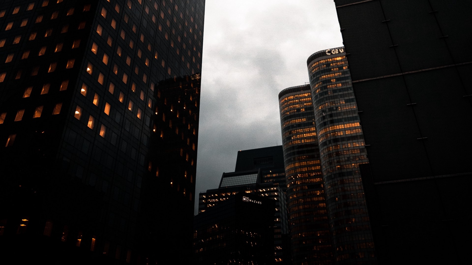 Night city skyscrapers with illuminated windows HD Wallpaper