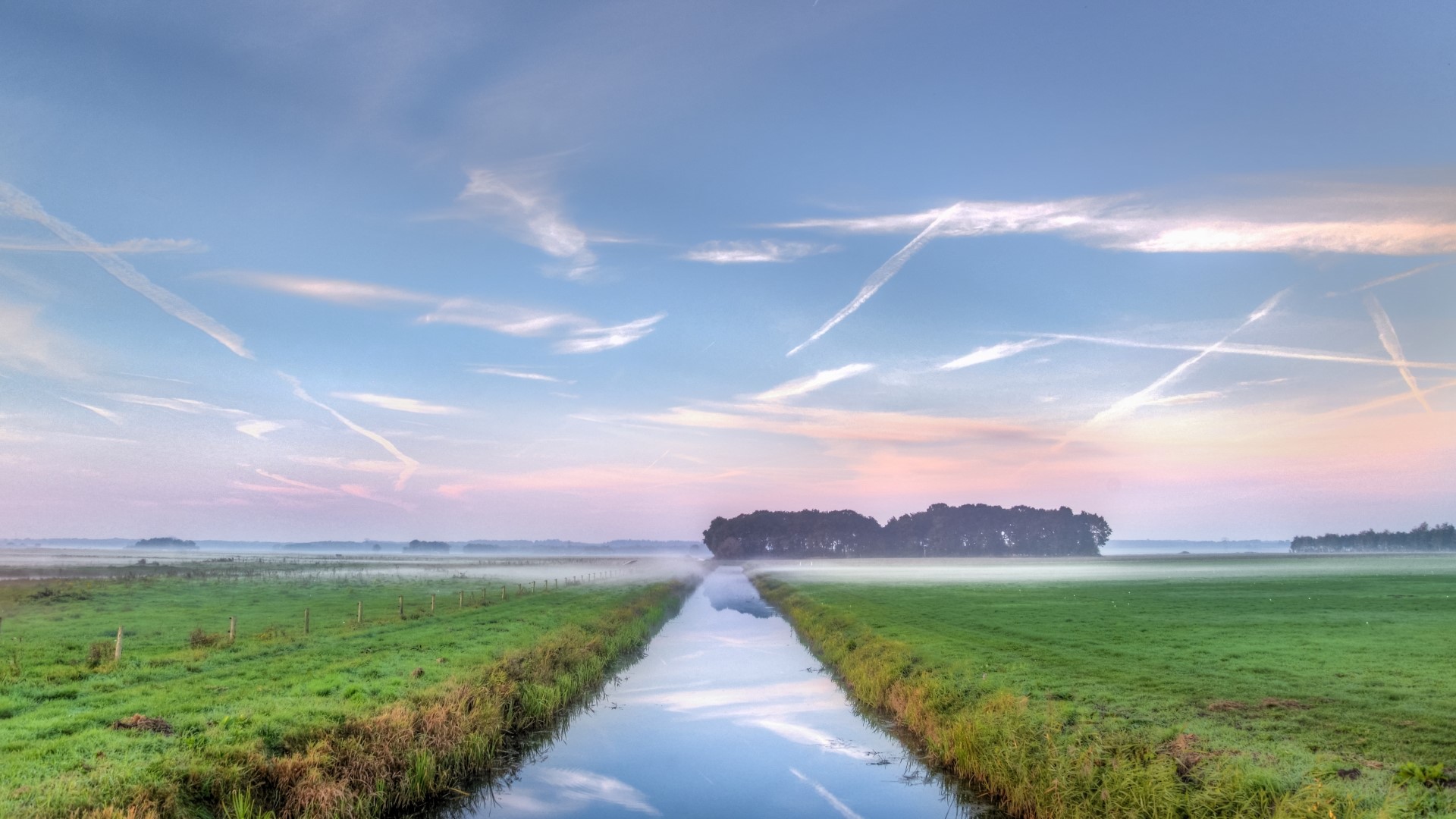 Canal through misty fields at sunrise HD Wallpaper