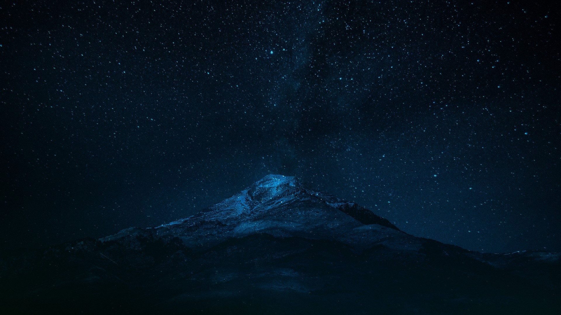 Dark blue mountain under a starry night sky HD Wallpaper