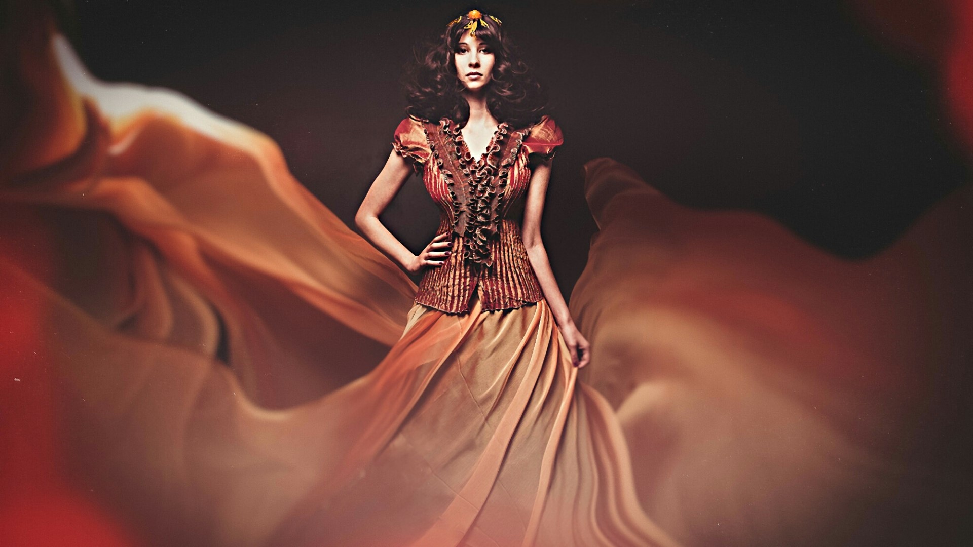 Woman in ornate dress with flowing fabric HD Wallpaper
