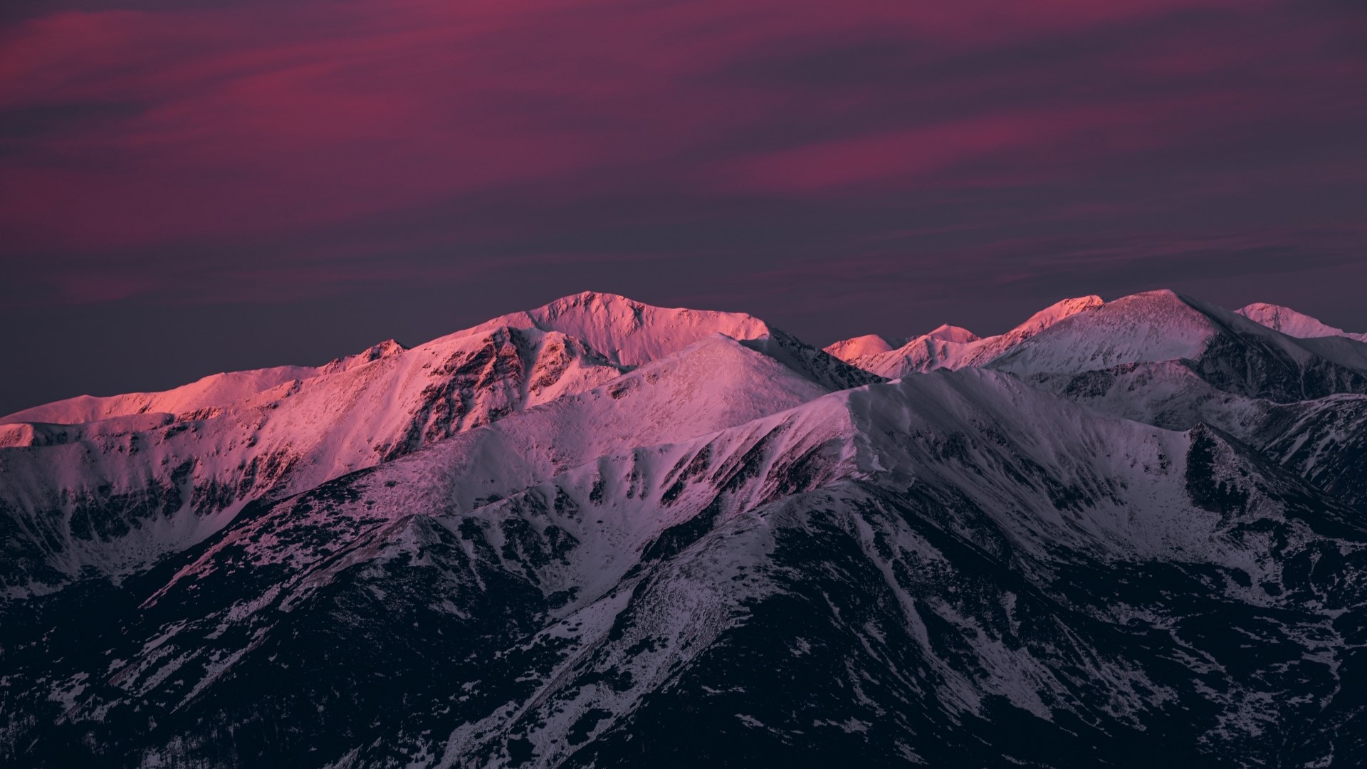 Snow-covered mountains at sunset HD Wallpaper