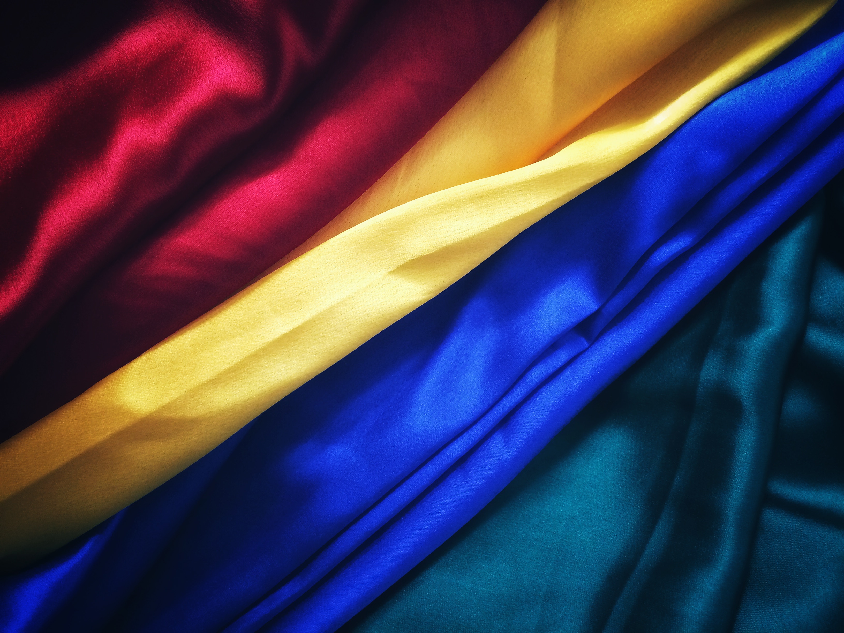 Red, Yellow, Blue, and Teal Fabric Folds HD Wallpaper
