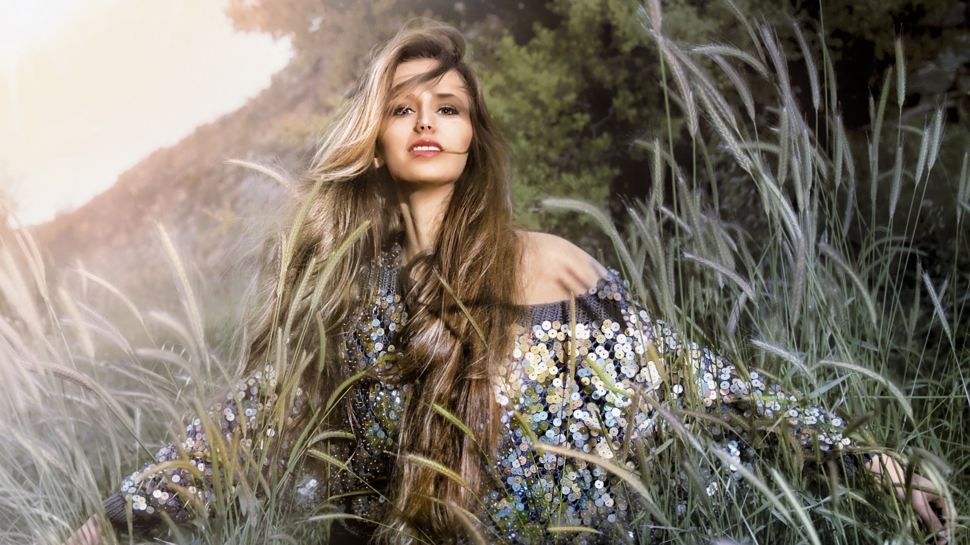 Woman in sequined top in tall grass HD Wallpaper