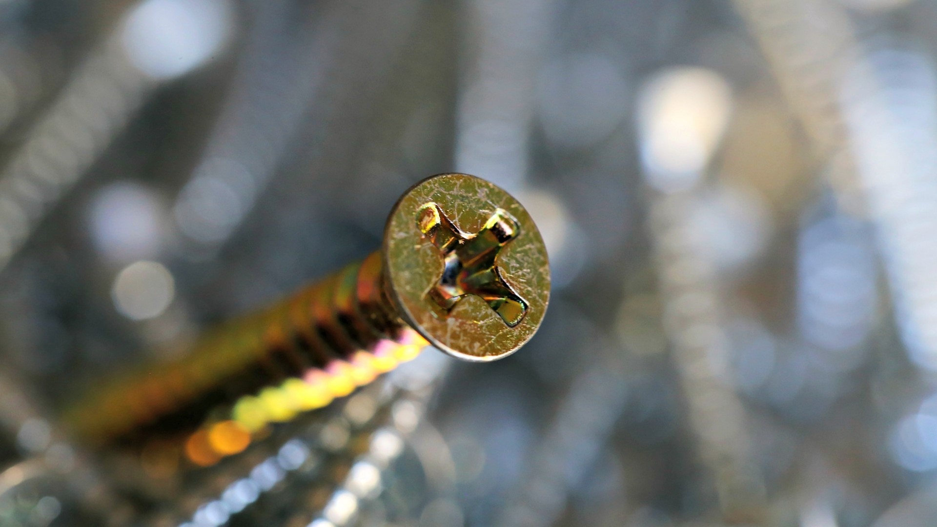 Close-up of a gold screw head HD Wallpaper