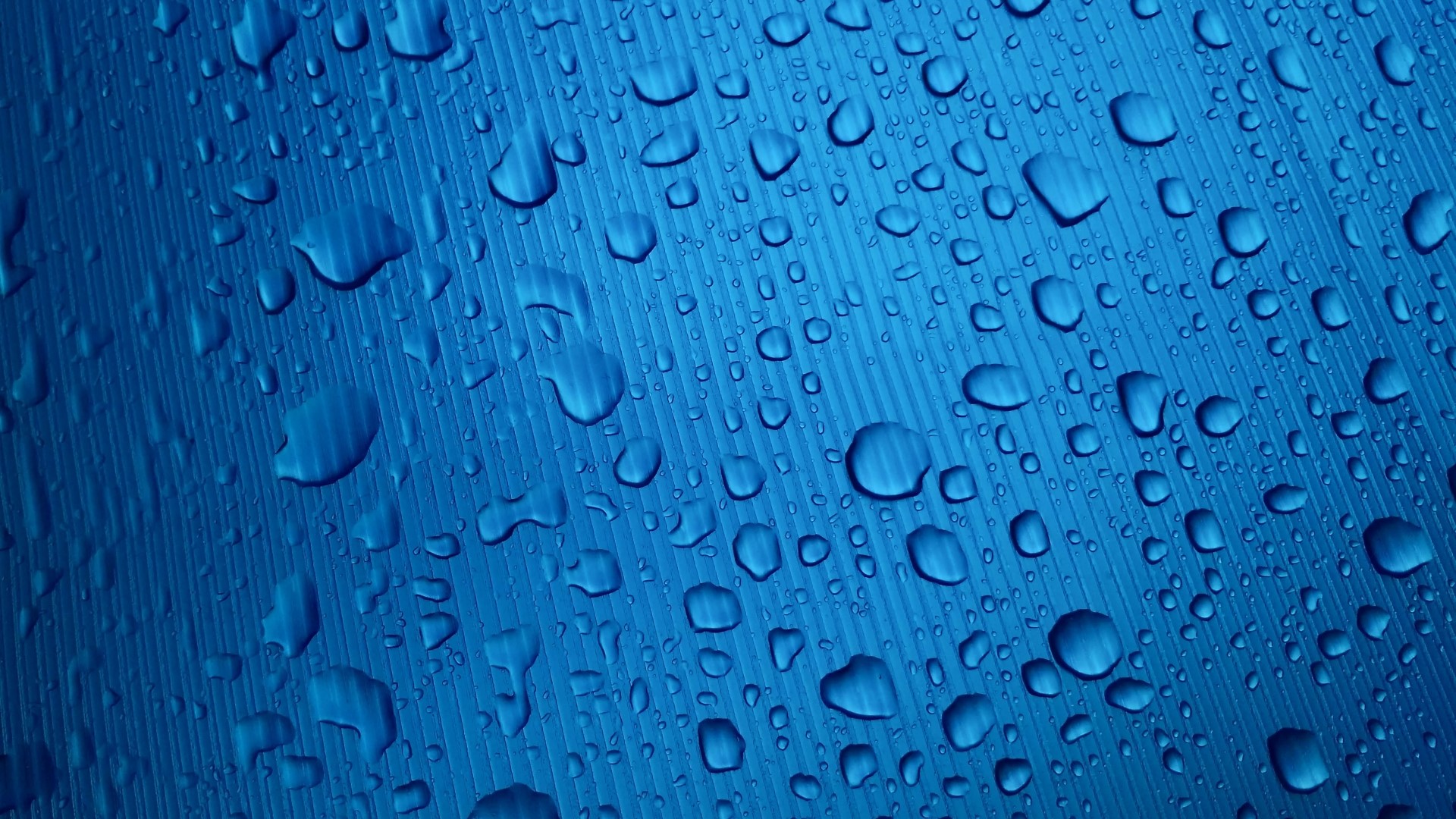 Blue Surface with Water Droplets HD Wallpaper