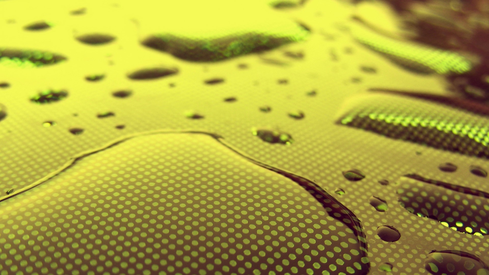 Water drops on a textured yellow surface HD Wallpaper