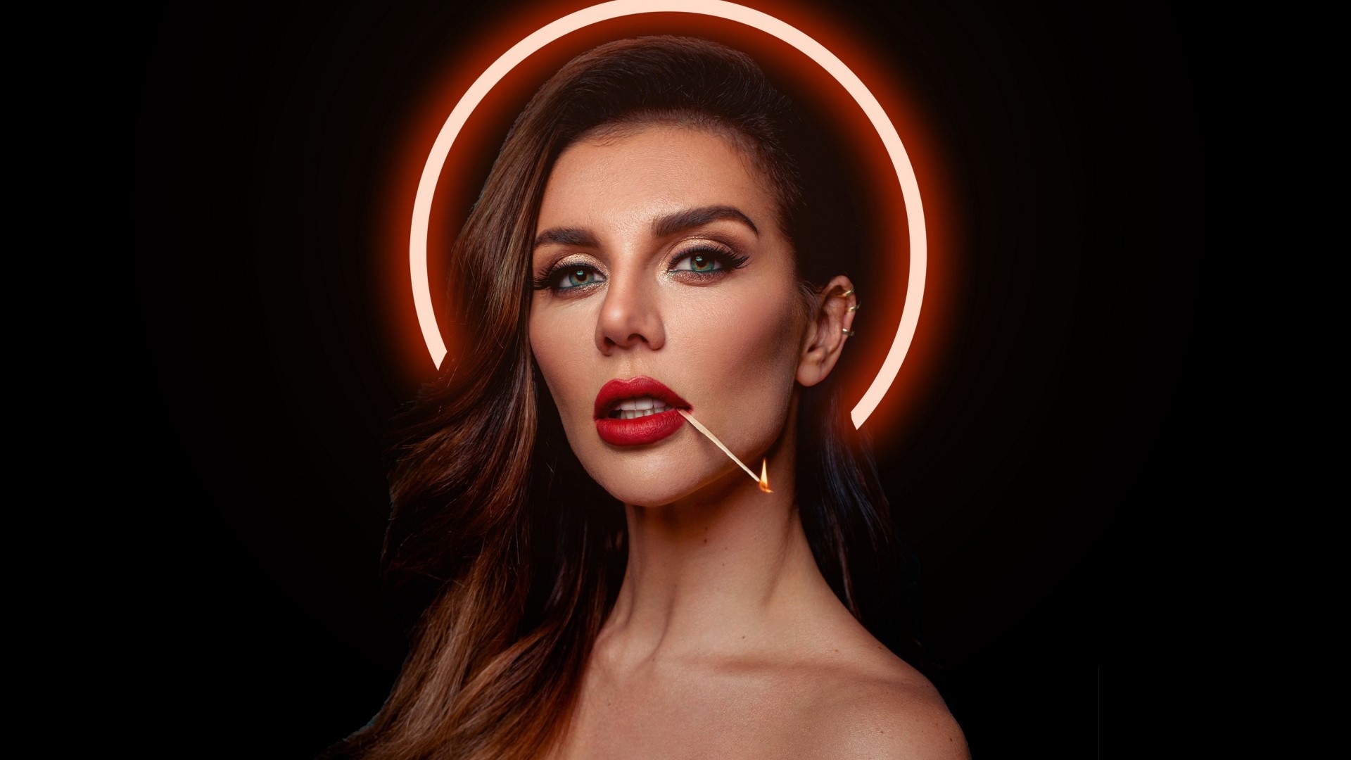 Woman with match in mouth and halo HD Wallpaper