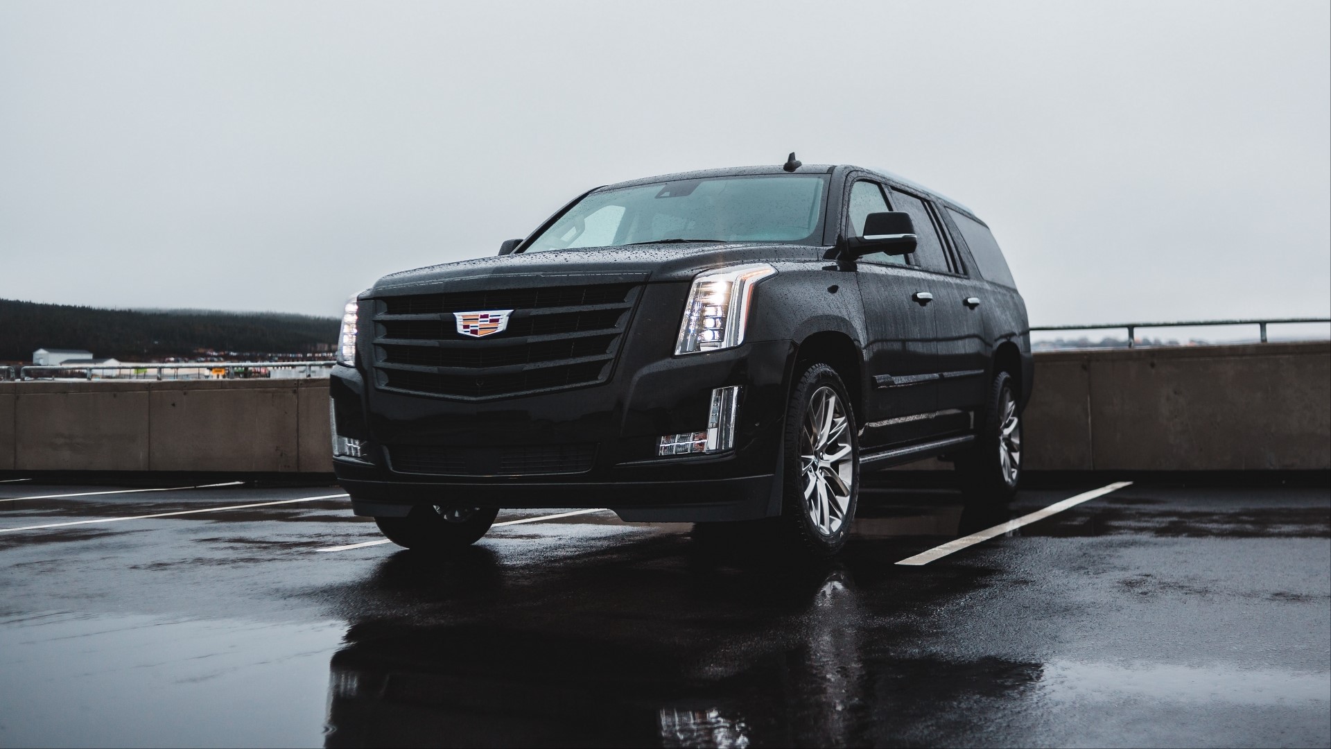 Black Cadillac Escalade on a Wet Parking Lot HD Wallpaper