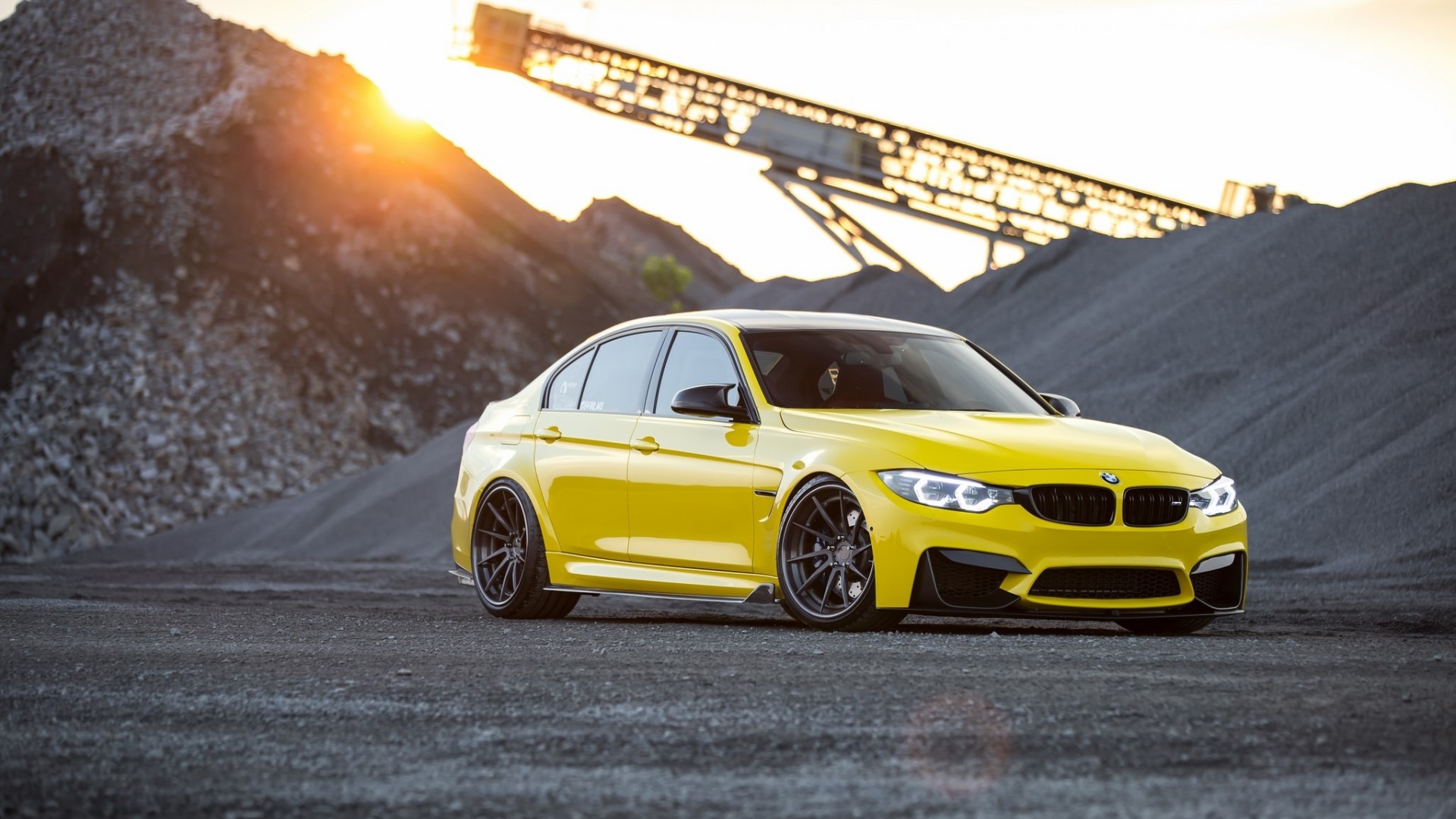 Yellow BMW M3 Sedan on Gravel HD Wallpaper