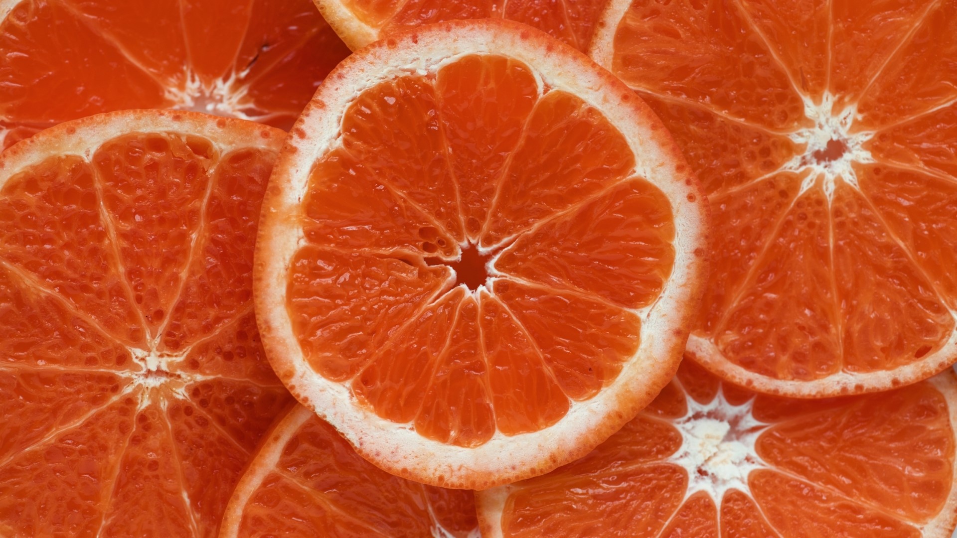 Close-up of sliced oranges HD Wallpaper