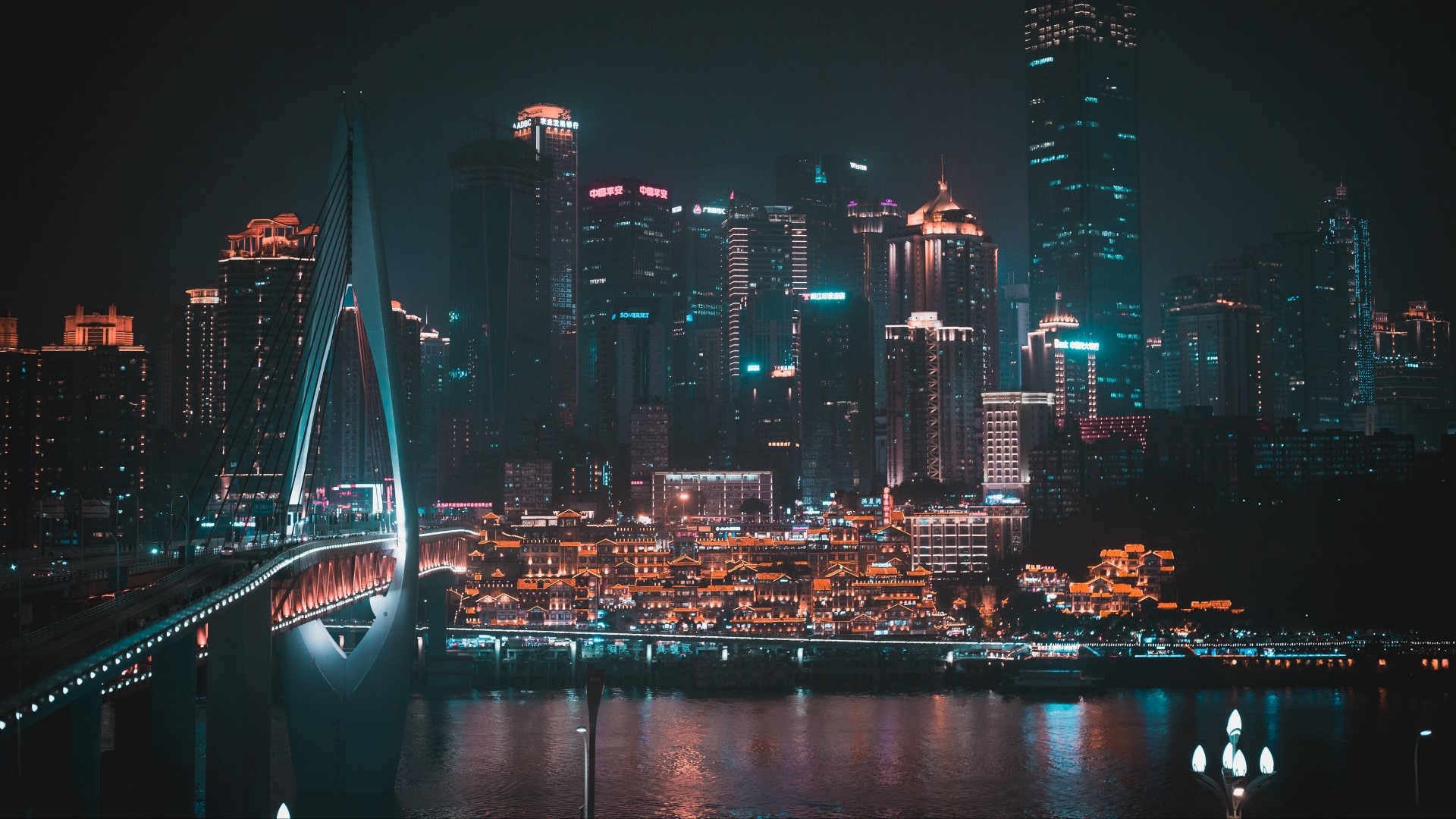 Night city skyline with illuminated bridge HD Wallpaper