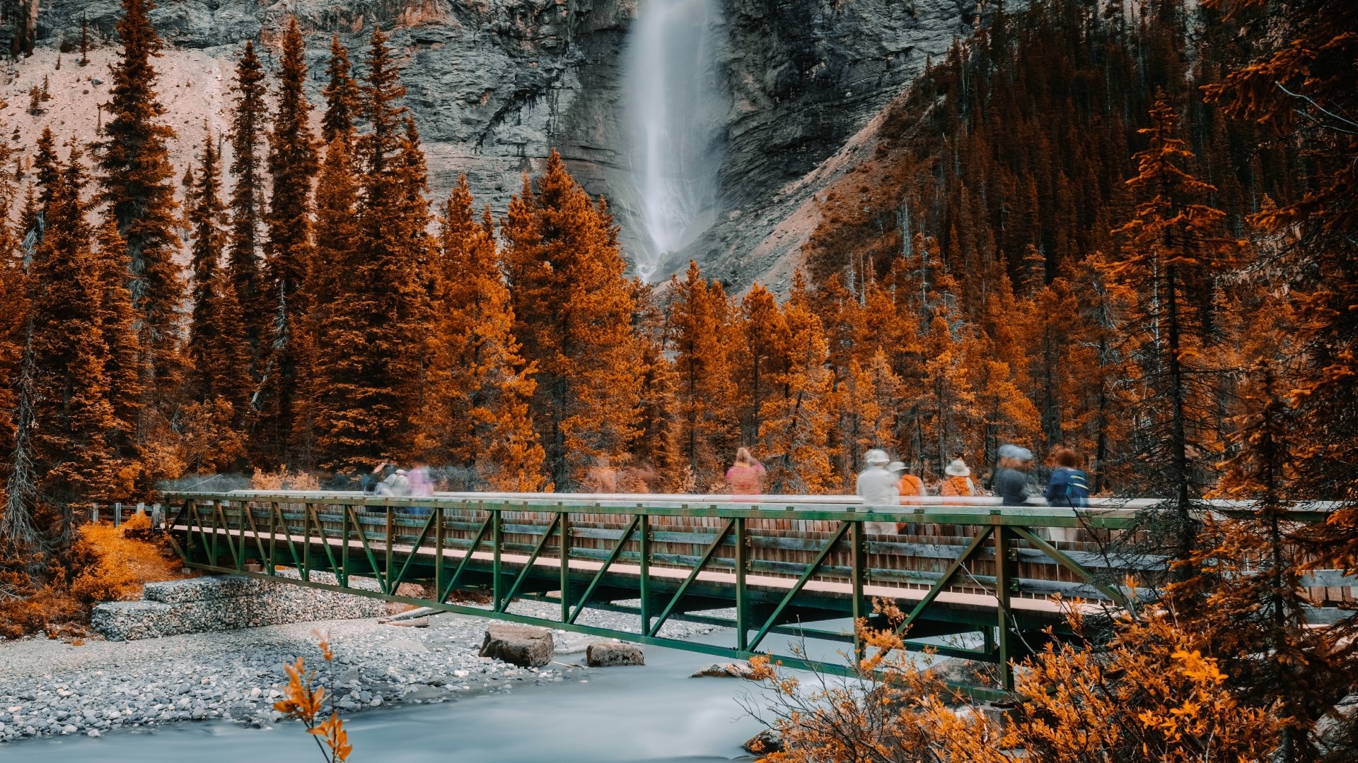 Bridge over river with waterfall and autumn trees HD Wallpaper