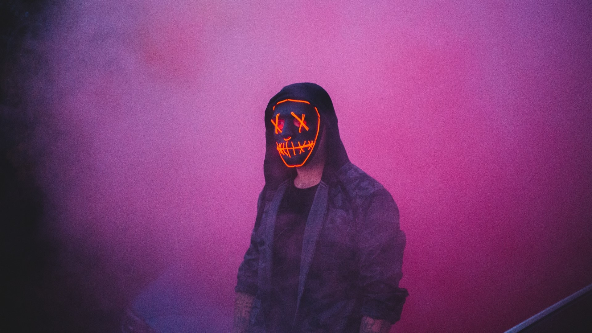 Person wearing a purge mask in pink smoke HD Wallpaper