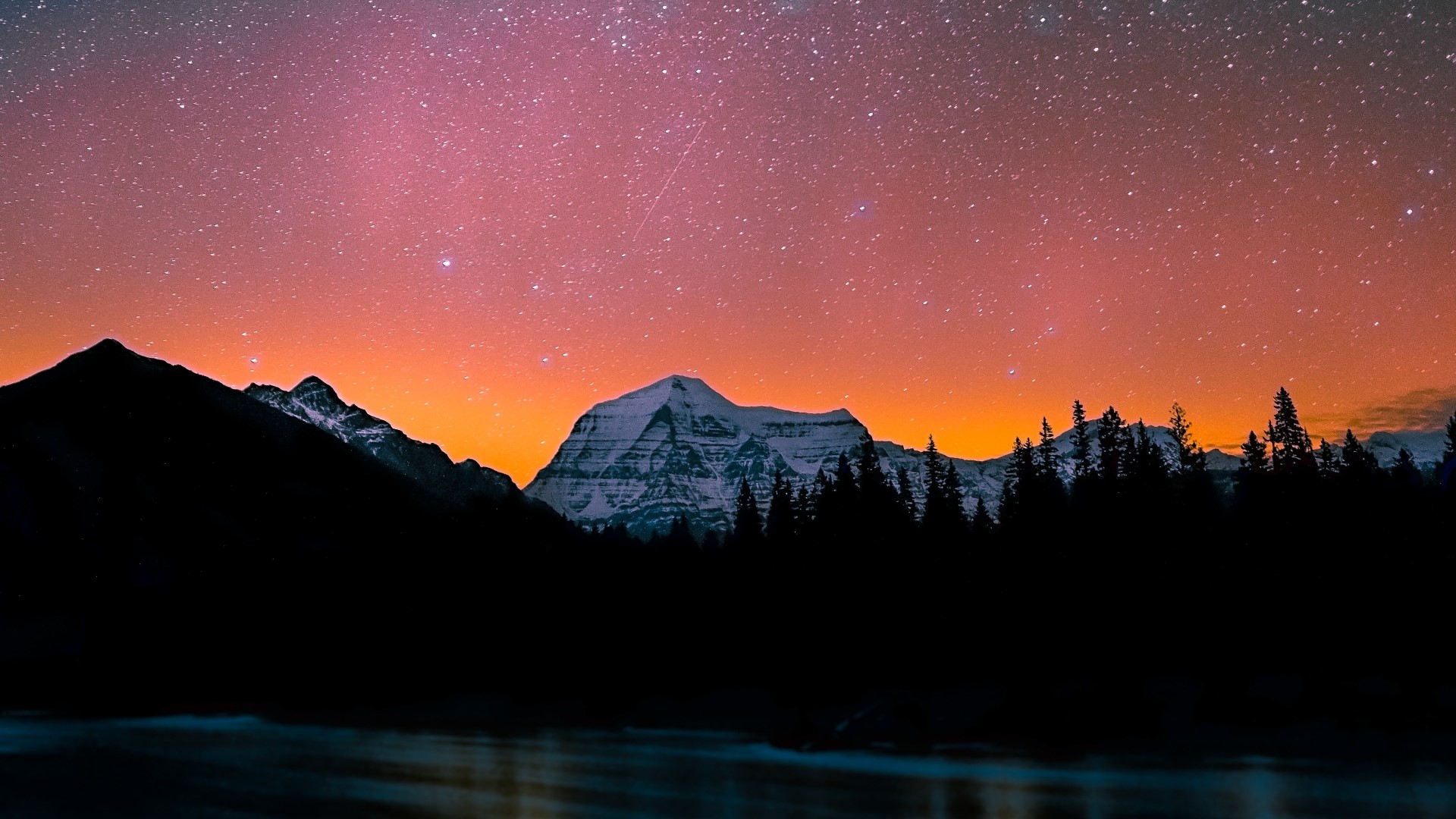 Mountain range under starry dusk sky HD Wallpaper