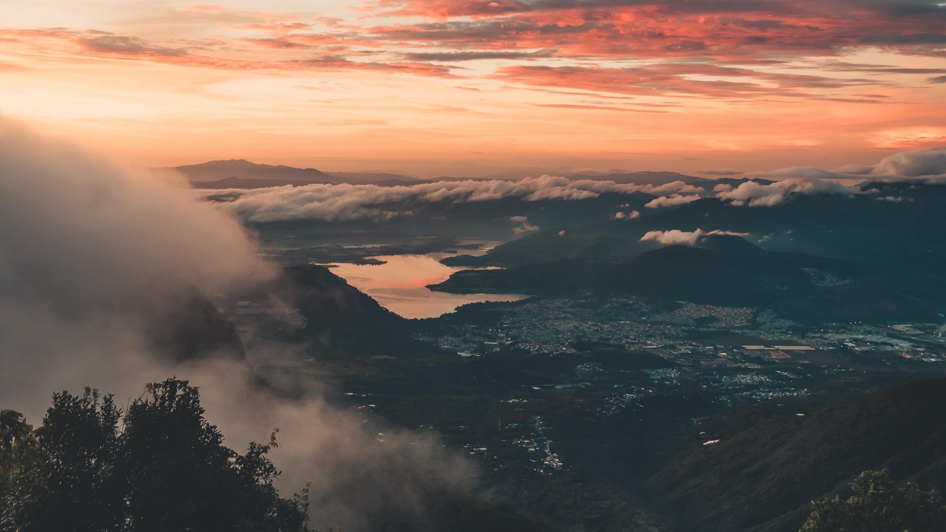Sunset over mountains and lake with clouds HD Wallpaper