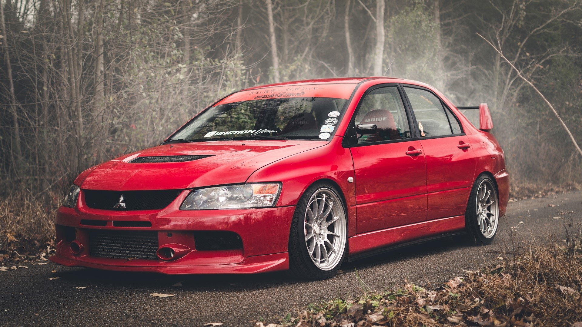 Red Mitsubishi Lancer Evolution parked on a road HD Wallpaper